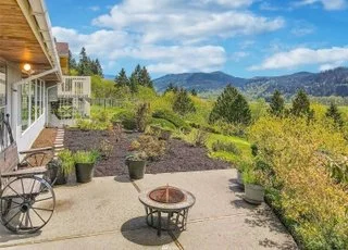 Patio view of surrounding property with seating area and landscaping at 21700 Calhoun Road Monroe, WA 98272