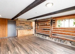 Livingroom with hardwood floors, windows and built in wet bar at 21700 Calhoun Road Monroe, WA 98272