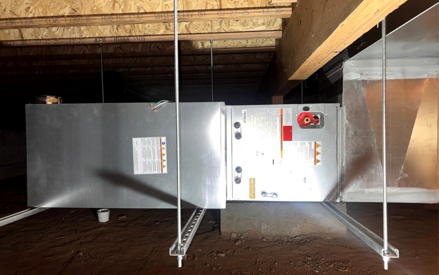 HVAC technicians installing ductwork during new home construction in Southern Colorado