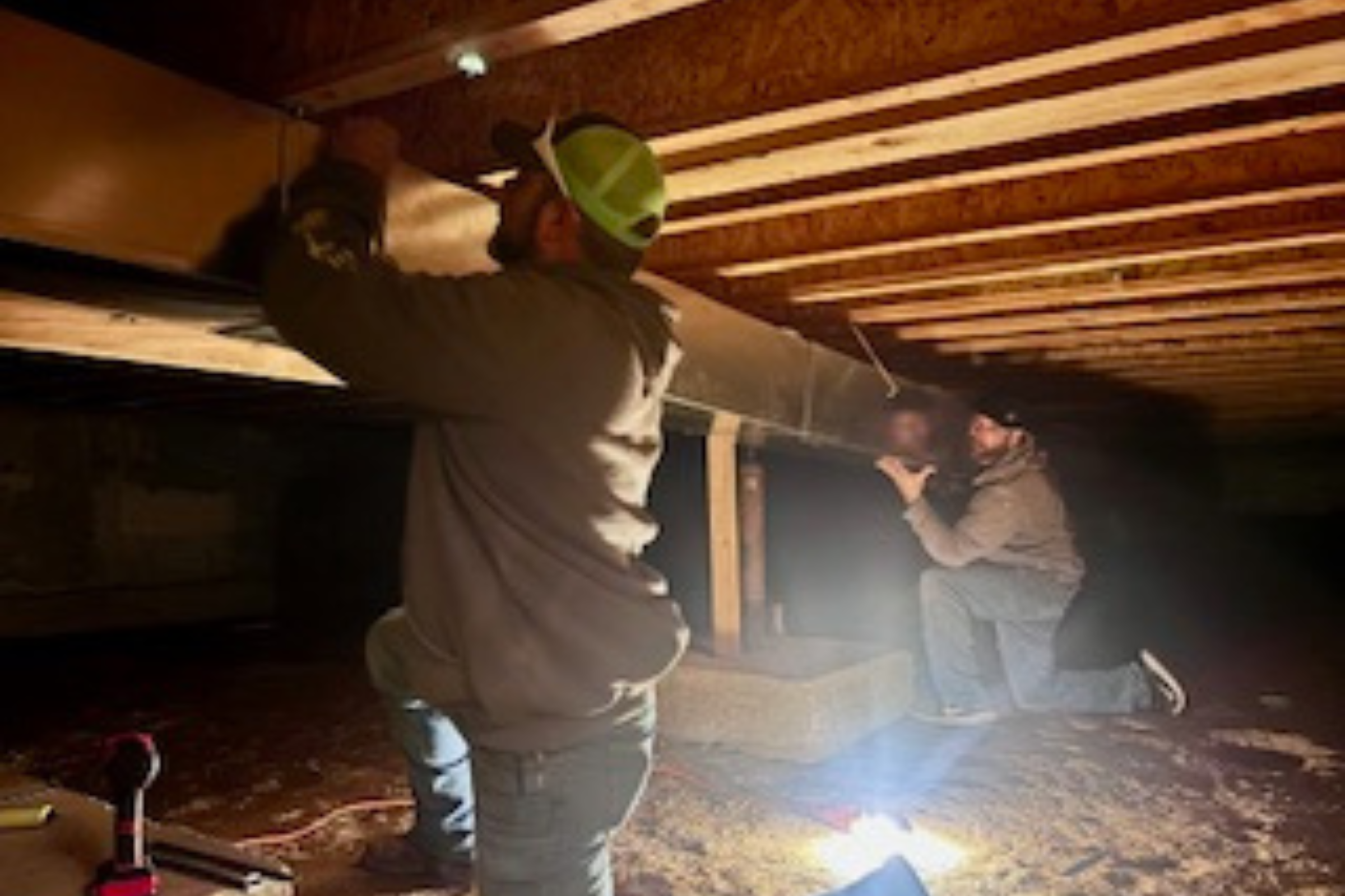 HVAC technicians installing ductwork during new home construction in Southern Colorado