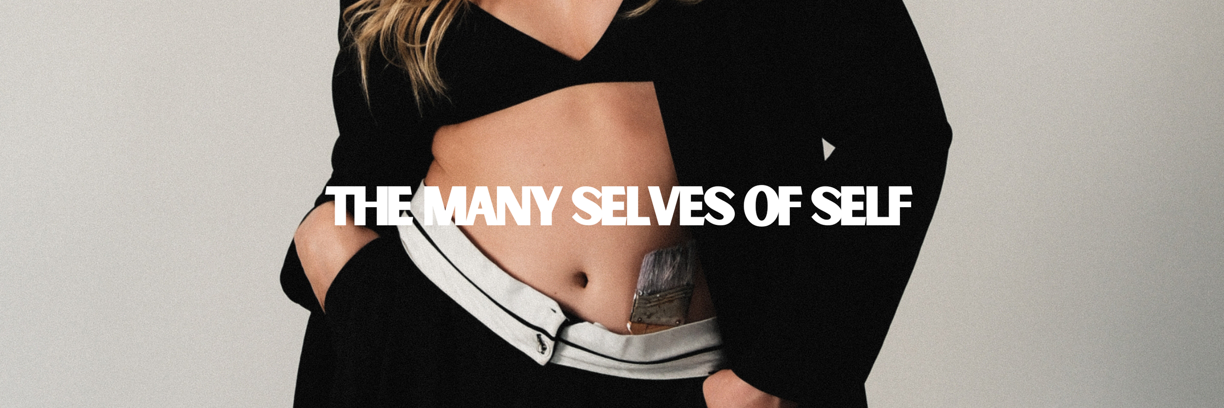 A person wearing a black jacket with white stripes on the tie and unzipped to reveal their midriff. The text 'THE MANY SELVES OF SELF' is overlaid on the image.