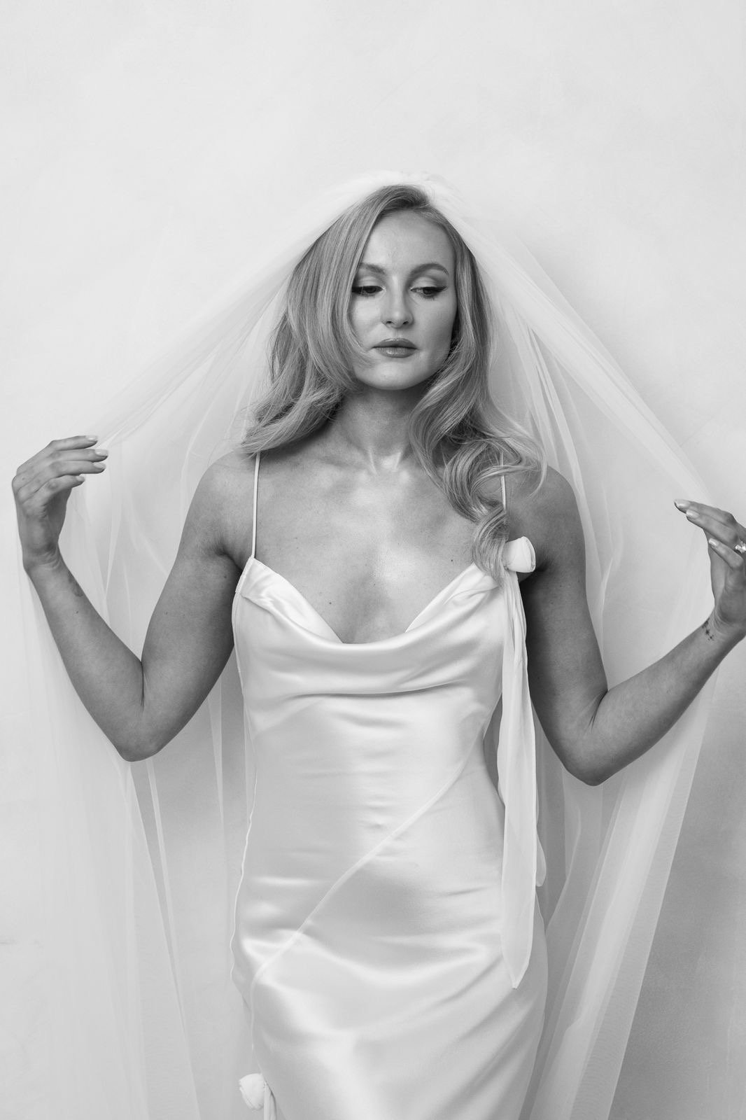 Model Maisie wearing The Charlie Veil, a plain soft Italian tulle bridal veil with a light, natural drape