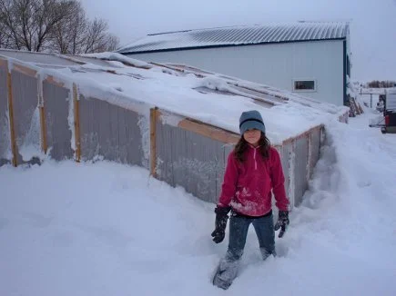 Joelle Helps Keep Snow Off Hothouse