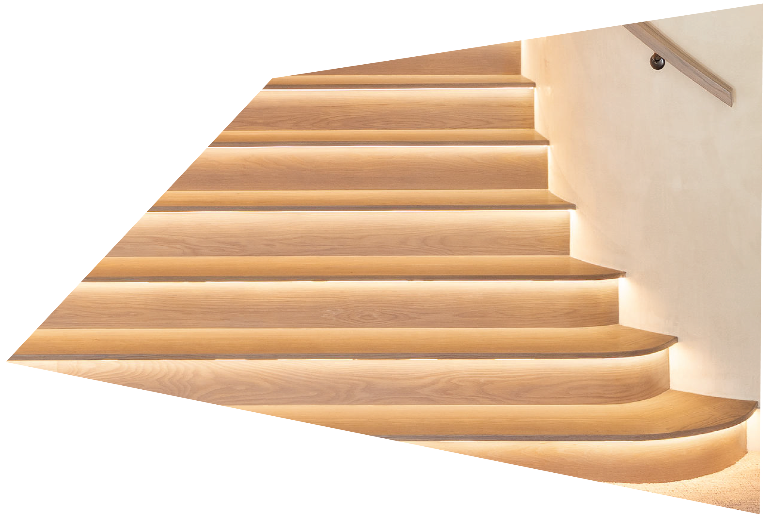 Wooden spiral staircase with built-in lights against a light-colored wall.