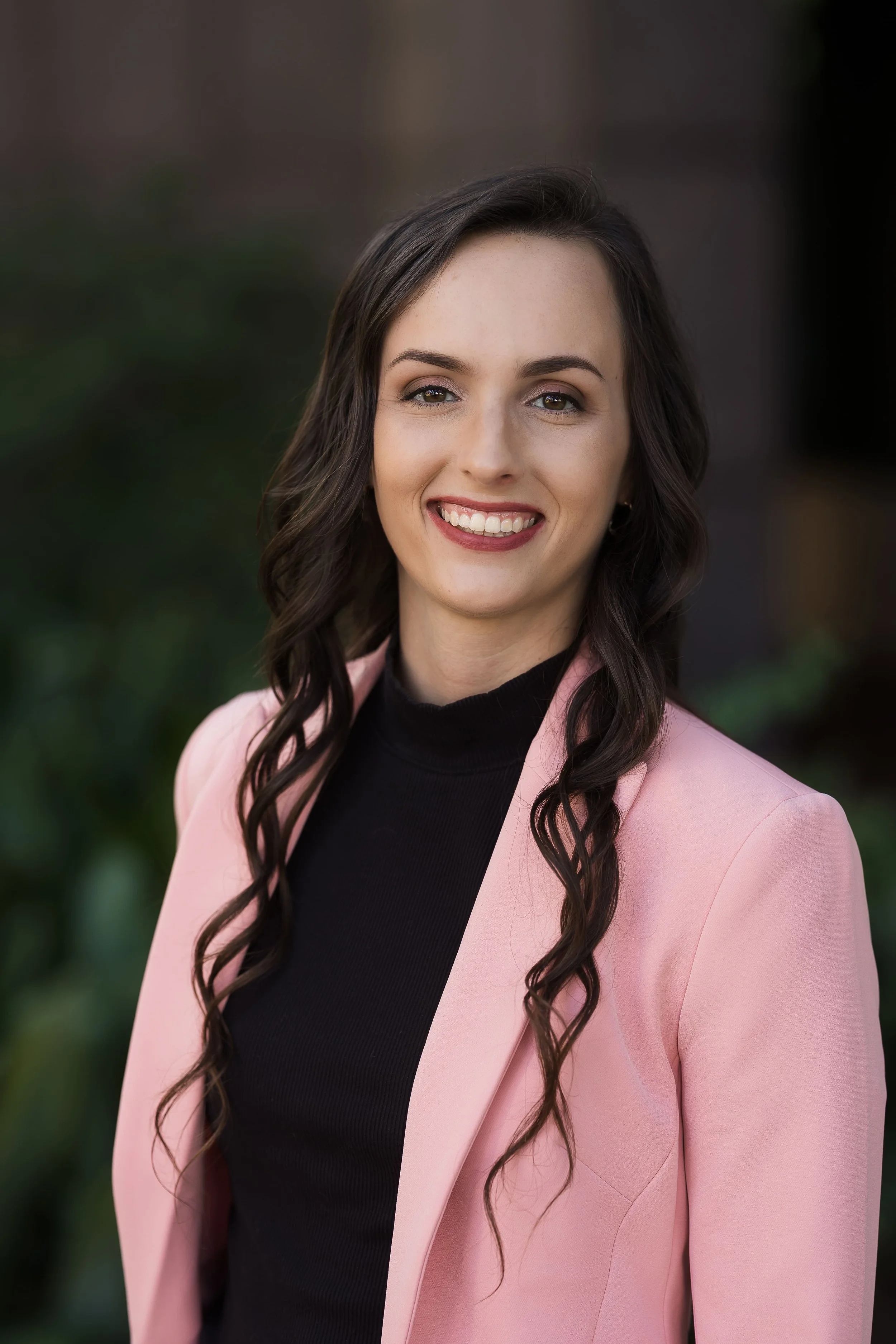 Outdoor professional headshot outside the Leon County Courthouse with natural light in Tallahassee, Florida