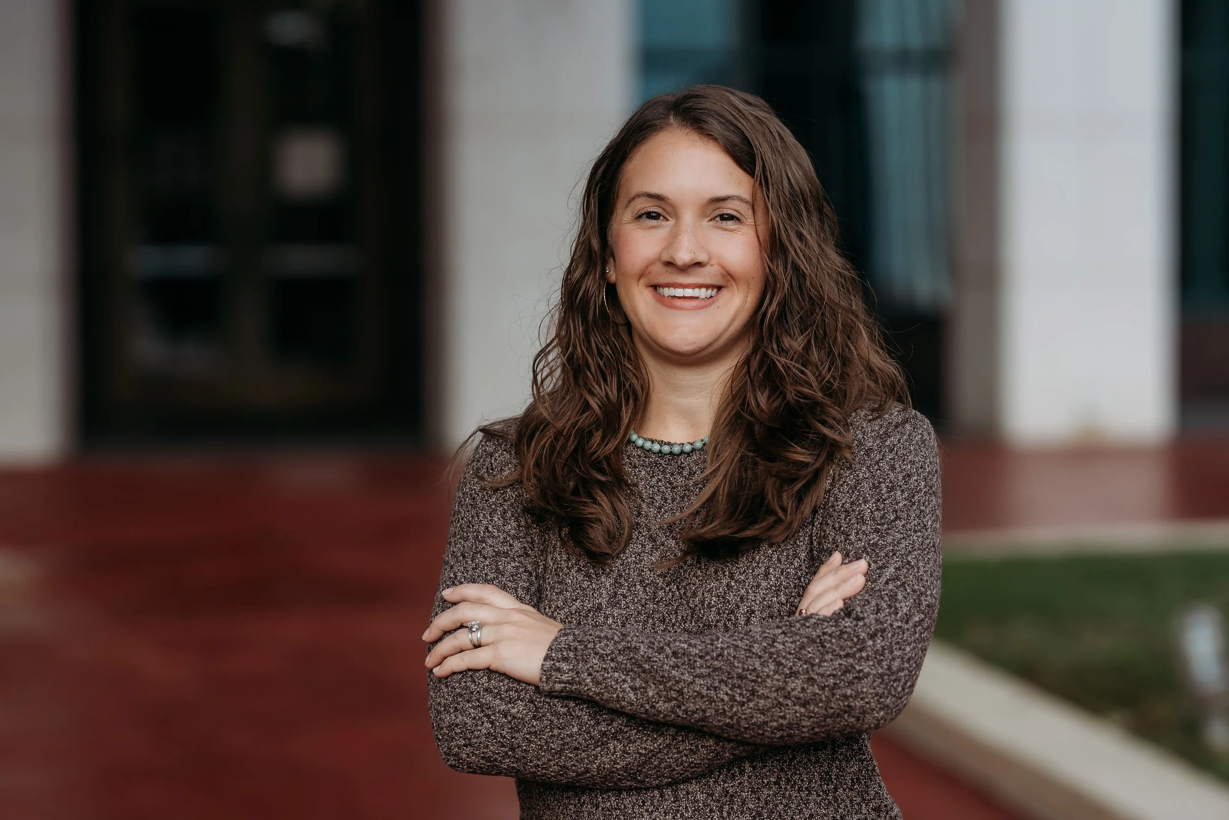 Outdoor professional headshot outside the Leon County Courthouse with natural light in Tallahassee, Florida