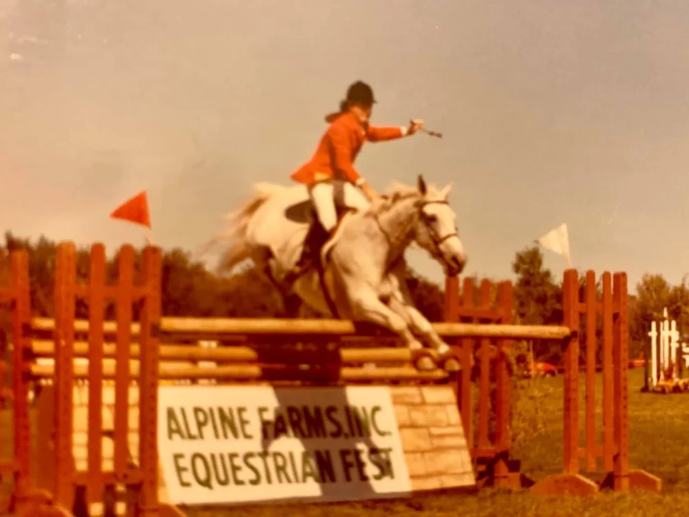Rider jumping at Alpine Farms in the 1970s