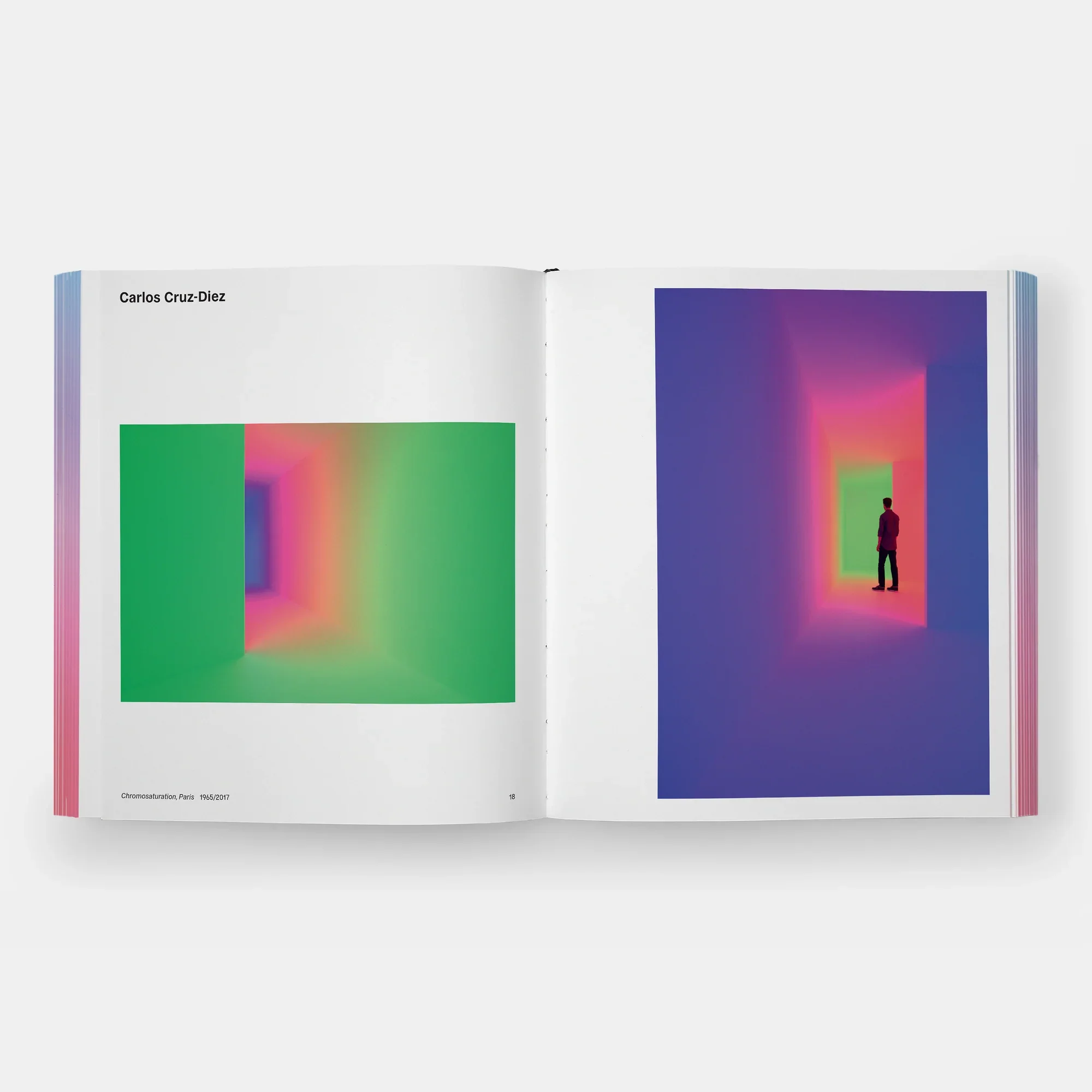 Rainbow Dreams Book by Olga Rei and Valentine Uhovski. Phaidon. Open book of colorful, abstract art installations. The left shows a tunnel-like structure with gradient colors from green to pink, tunnel with vibrant, glowing colors.