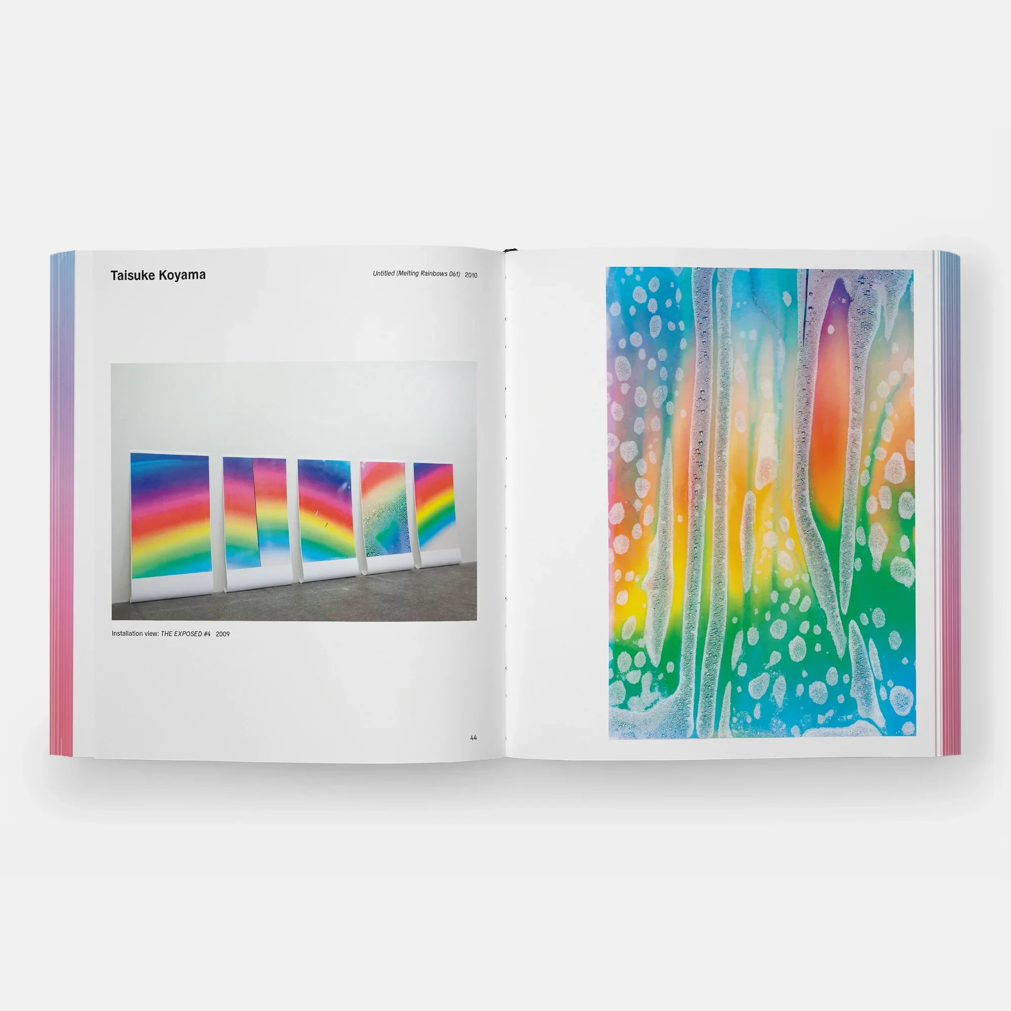 Rainbow Dreams Book by Olga Rei and Valentine Uhovski. Phaidon. Open art book displaying colorful rainbow-themed artwork on both pages, with a photo of rainbow paintings on the left page and an abstract rainbow watercolor on the right page.