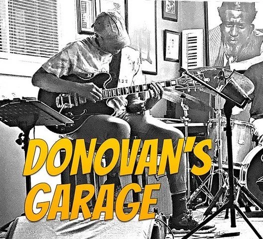 Donovan's Garage logo. A picture of Donovan Mixon playing guitar in a music studio with the words 'Donovan's Garage' in yellow text overlay.