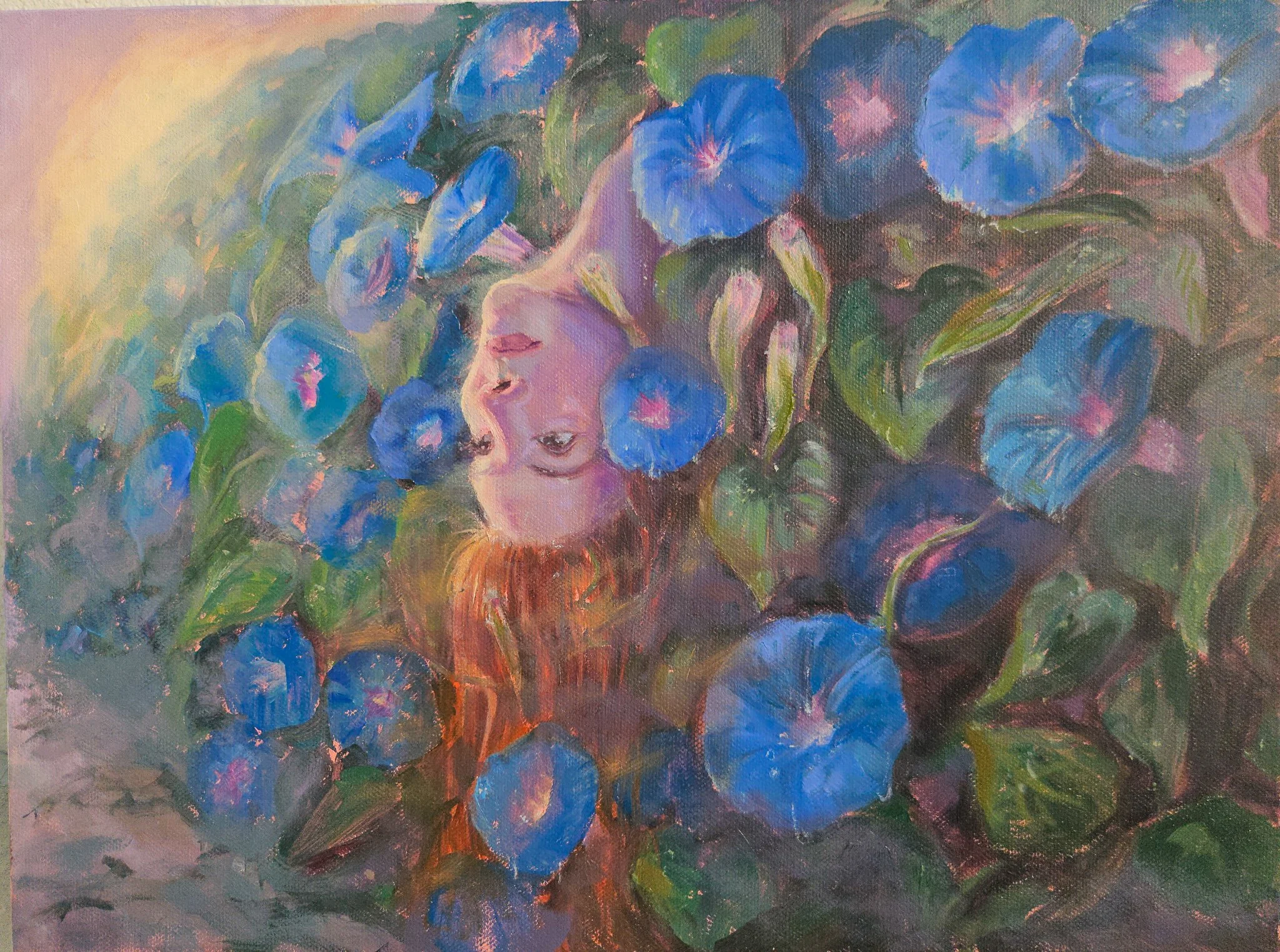 Painting of a woman's face emerging from morning glory flowers at dawn