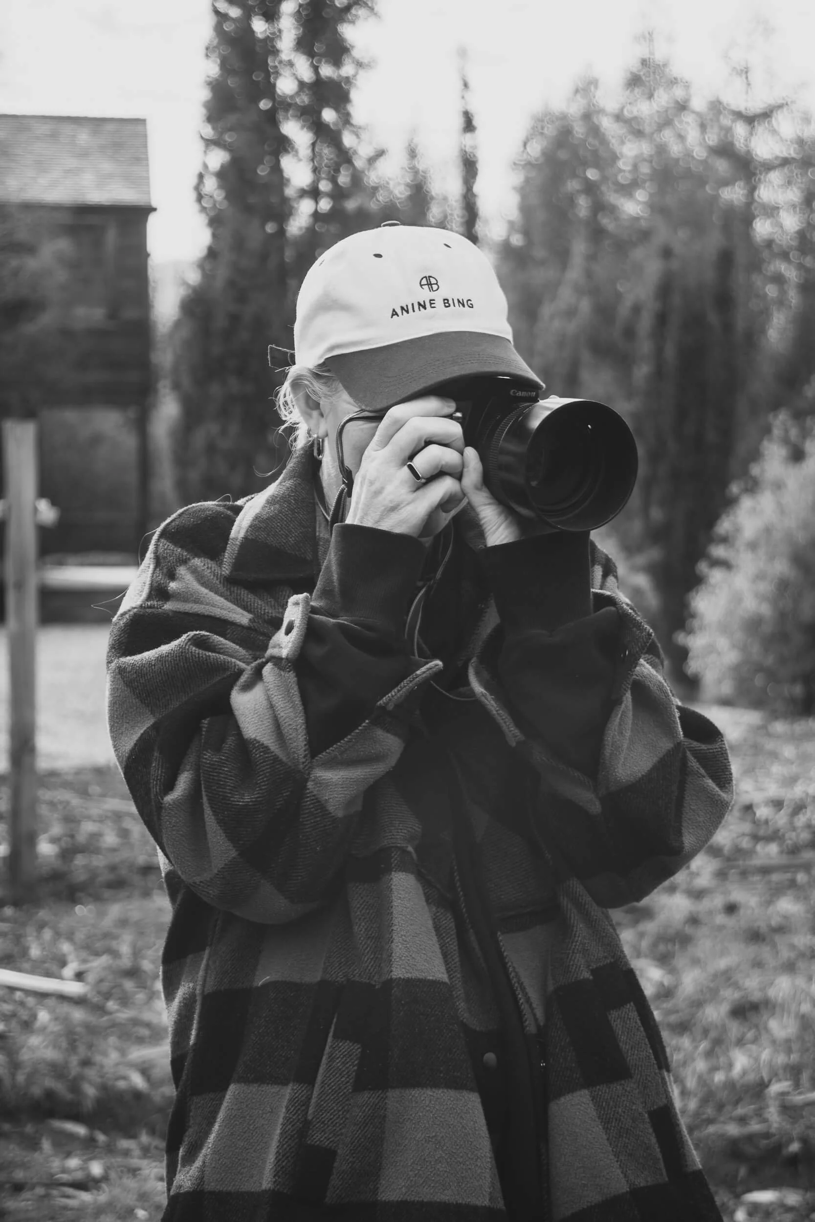 Person holding a camera up to their eye