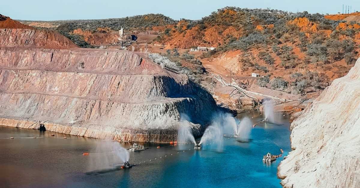 Aerial view of a tailings dam with pontoon floating evaporators