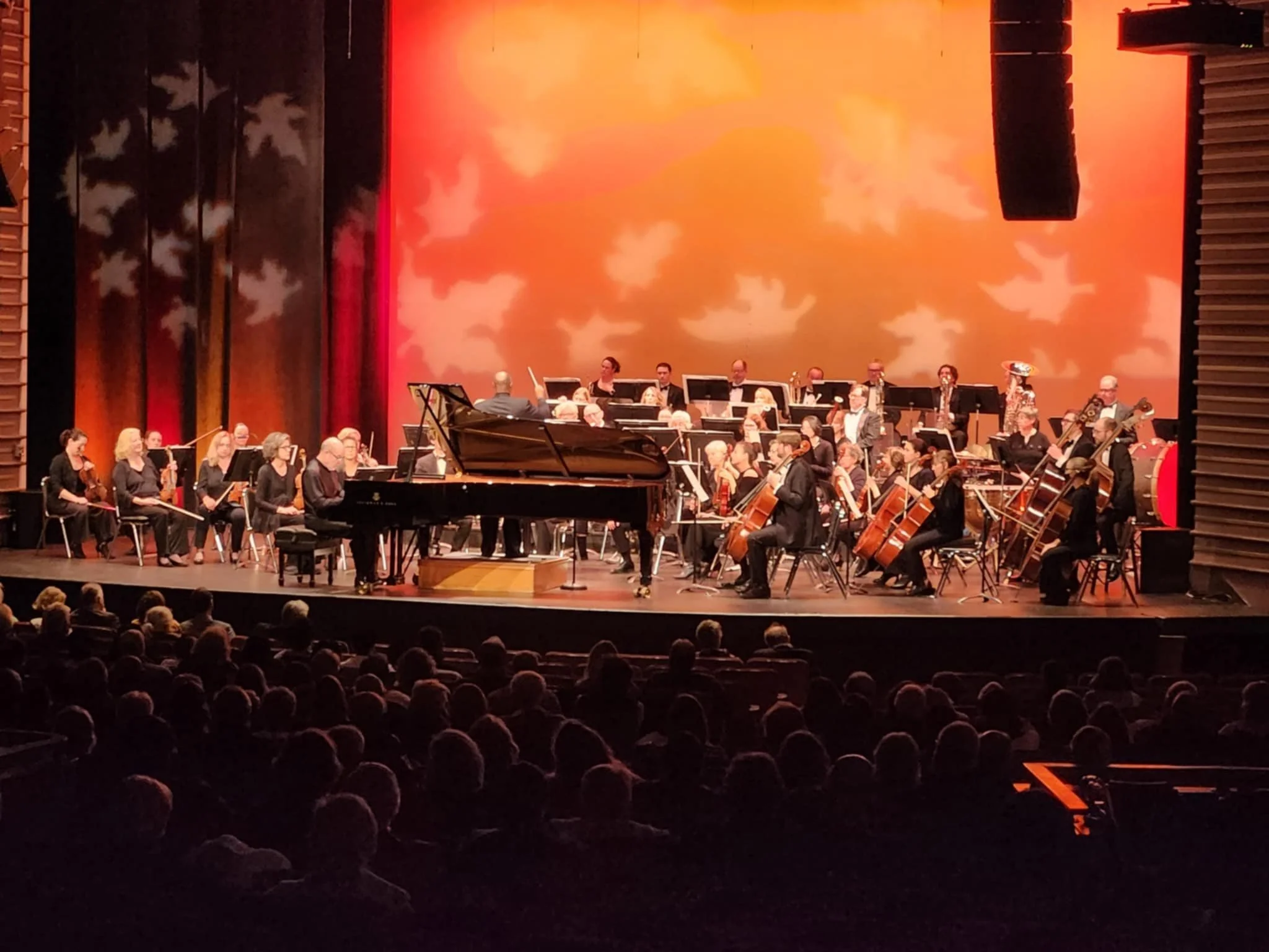 A full house watches the GBS orchestra and a piano soloist perform Gershwin