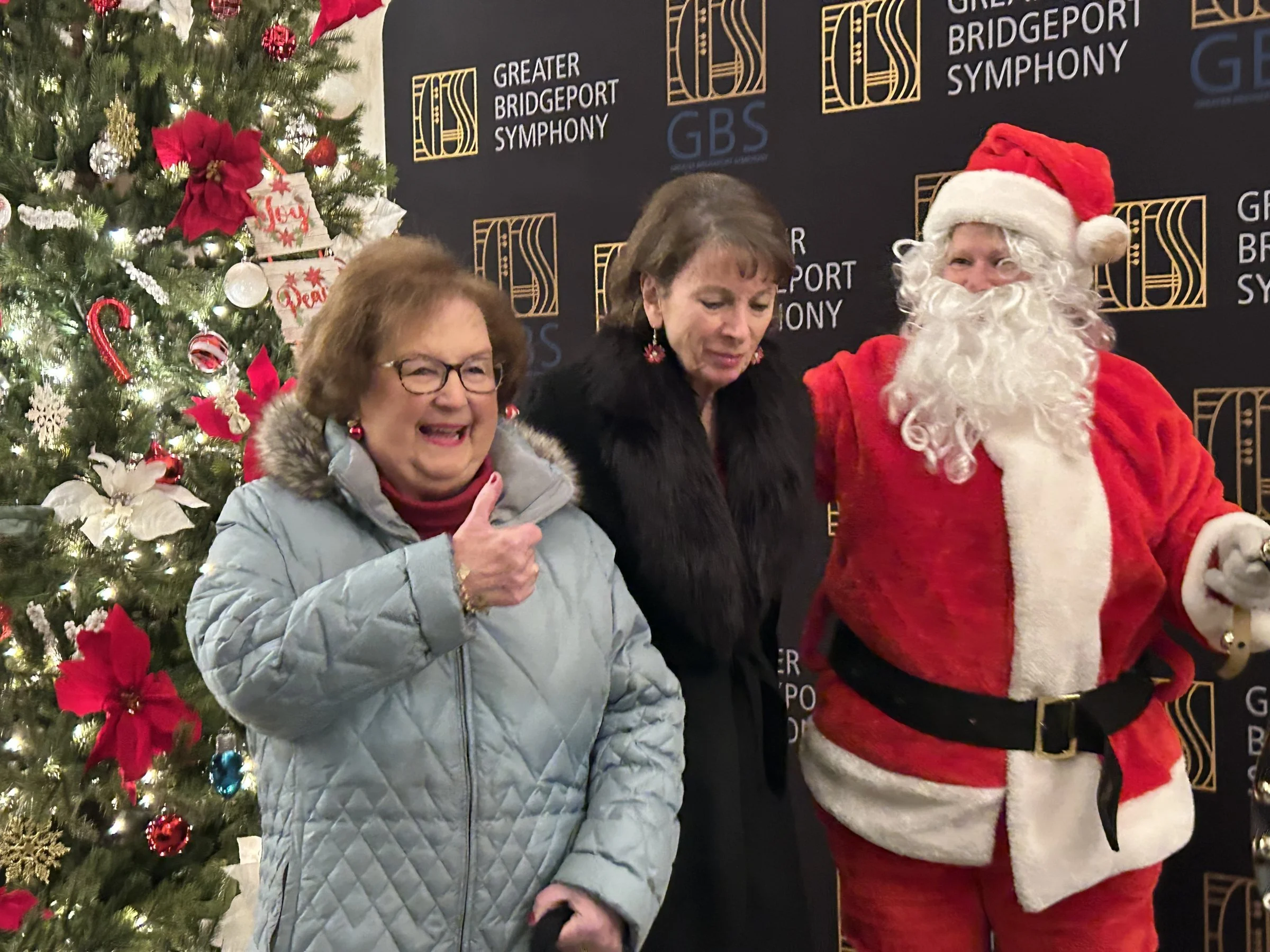 GBS patrons pose with Santa at the holiday photo wall