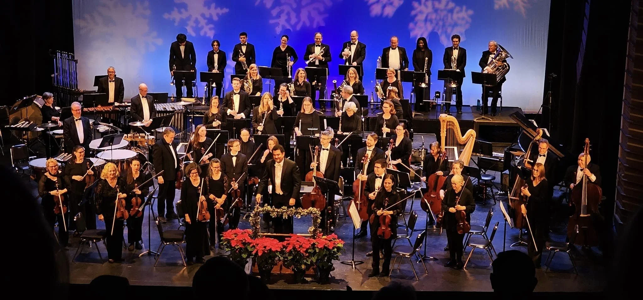 The GBS orchestra and chorus take a bow after a holiday concert