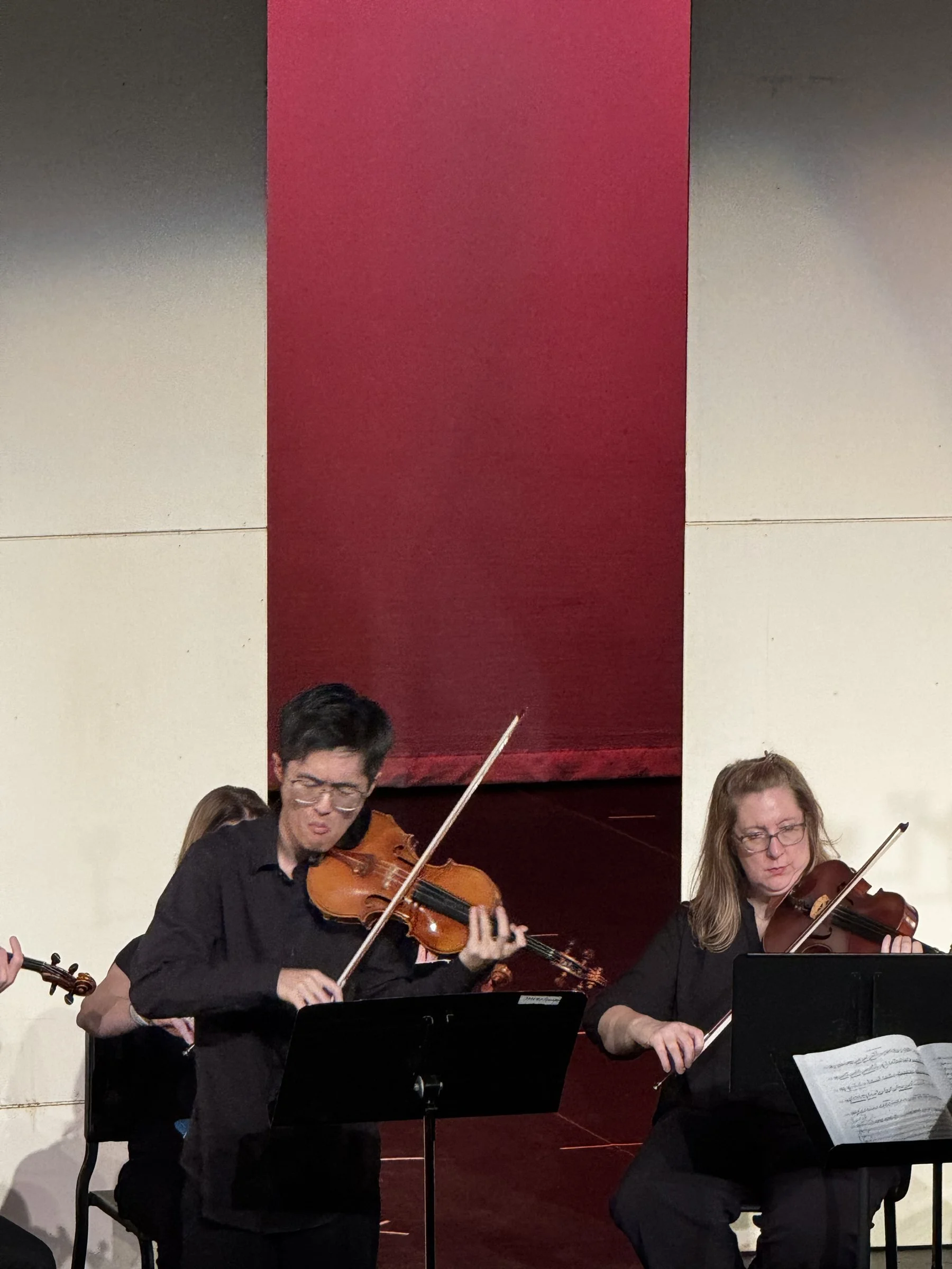 Two GBS violinists playing side by side