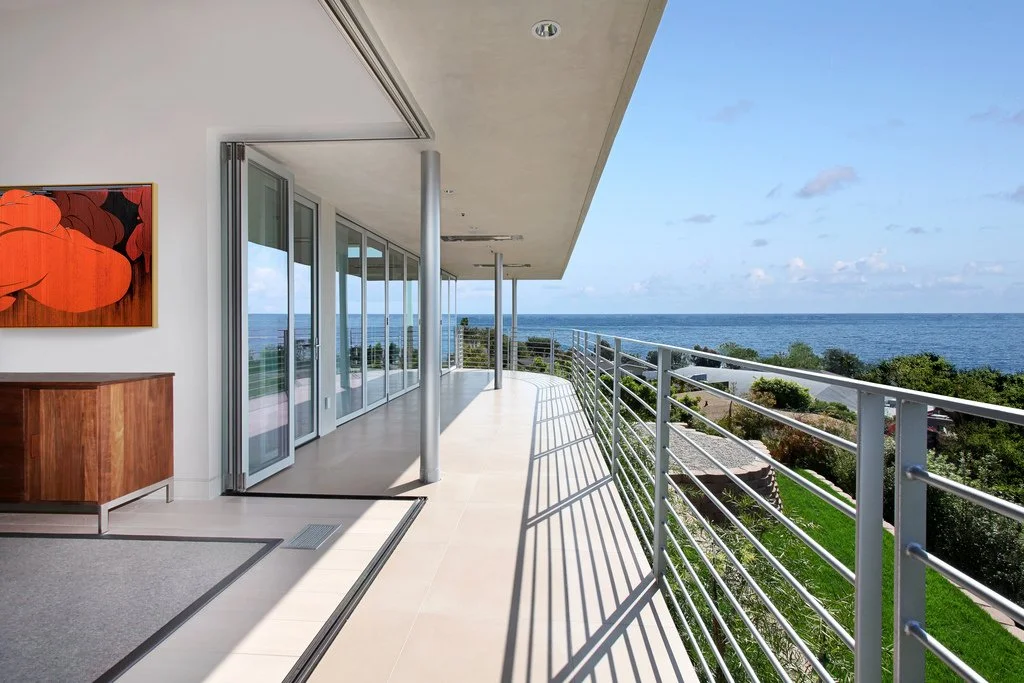 After: Wrap around patio shared with primary bedroom and living room to enjoy the views.