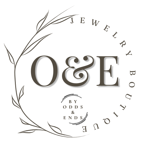 Jewelry brand logo with the initials O&E, surrounded by a decorative leaf design and the text "Jewelry by Odds & Ends".