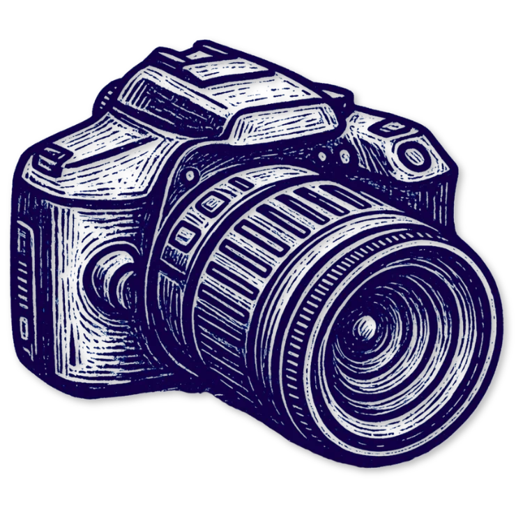 Two colleagues smiling and looking at documents in an office.