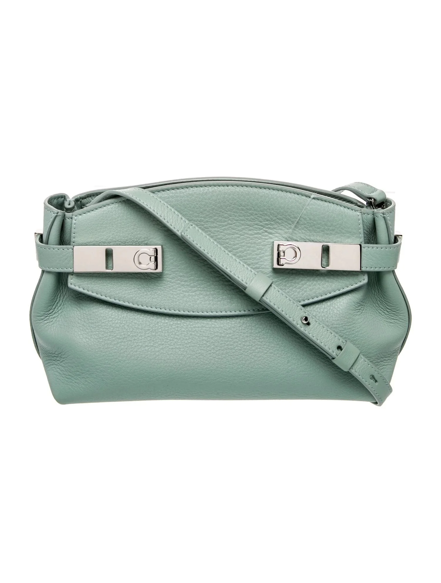 A light green leather handbag with silver hardware and an adjustable strap.