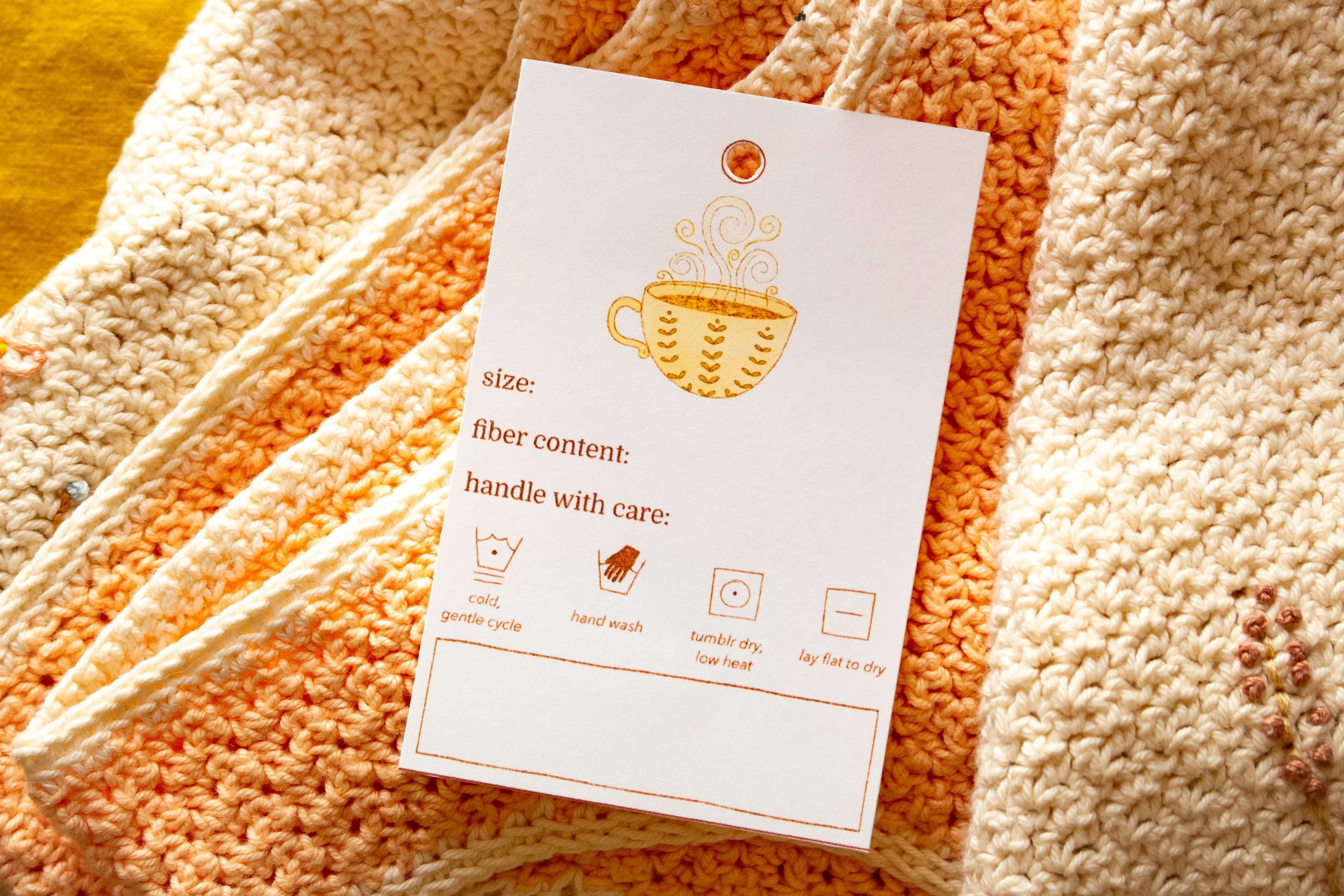 A care card for handmade fiber gifts featuring places to write size, fiber content, care, and washing instructions.