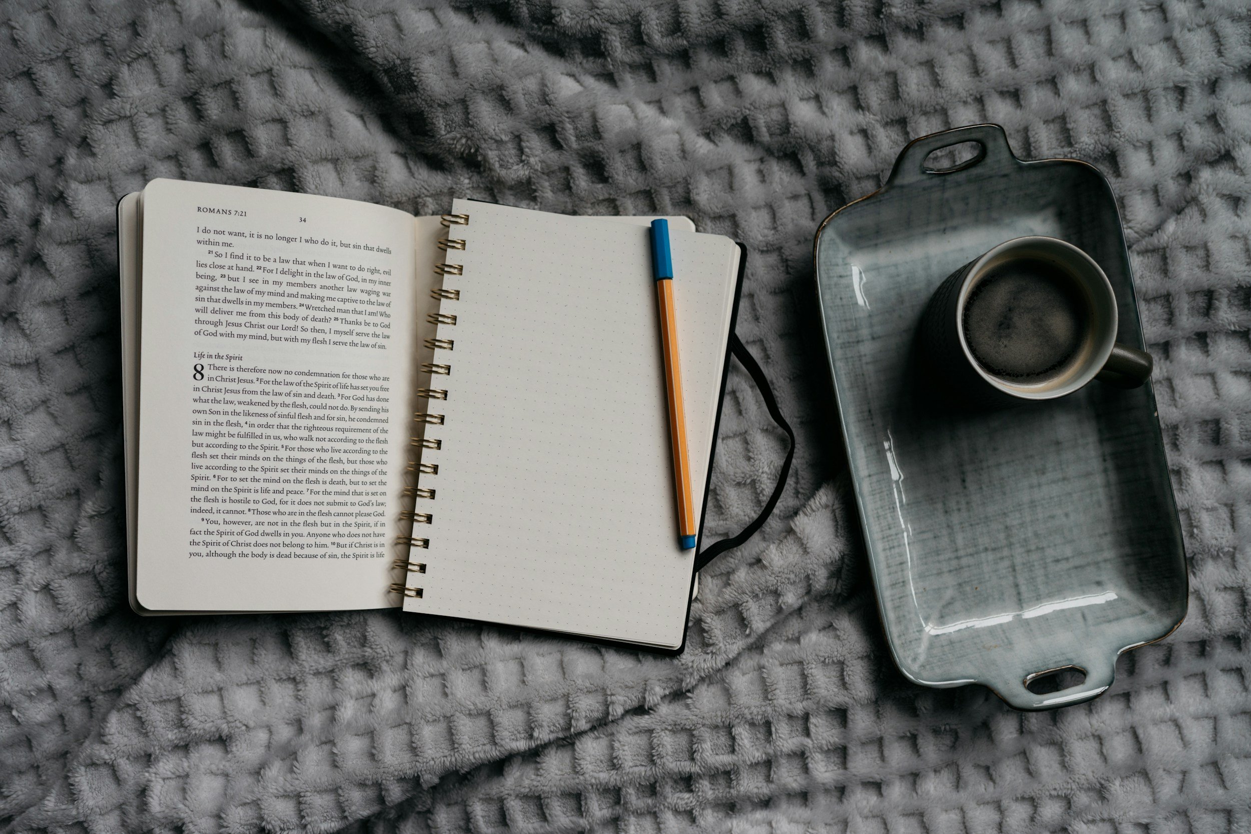 Notebook and tea representing a moment of self-reflection