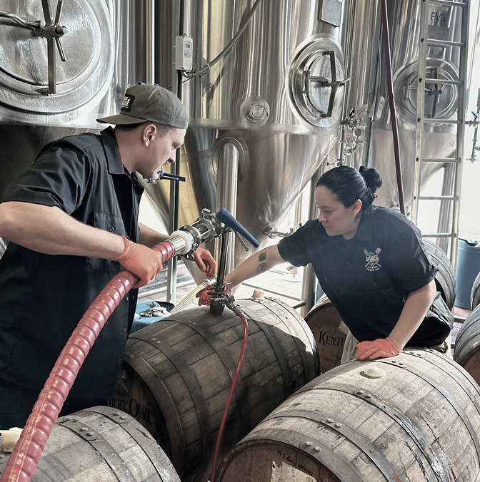 Brewers Filling Beer Barrels