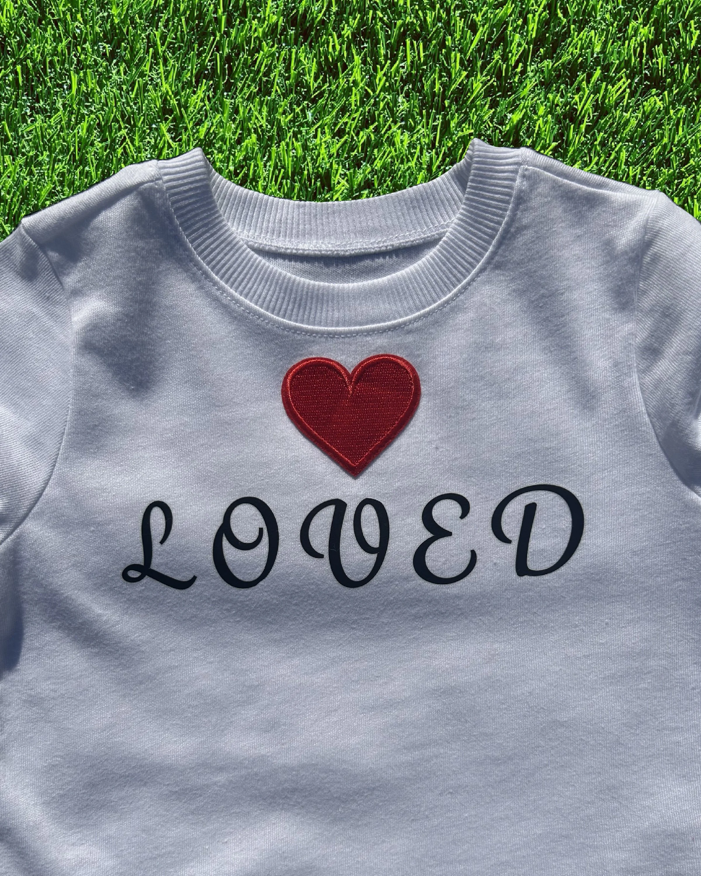 "Loved" in cursive letters (4t)