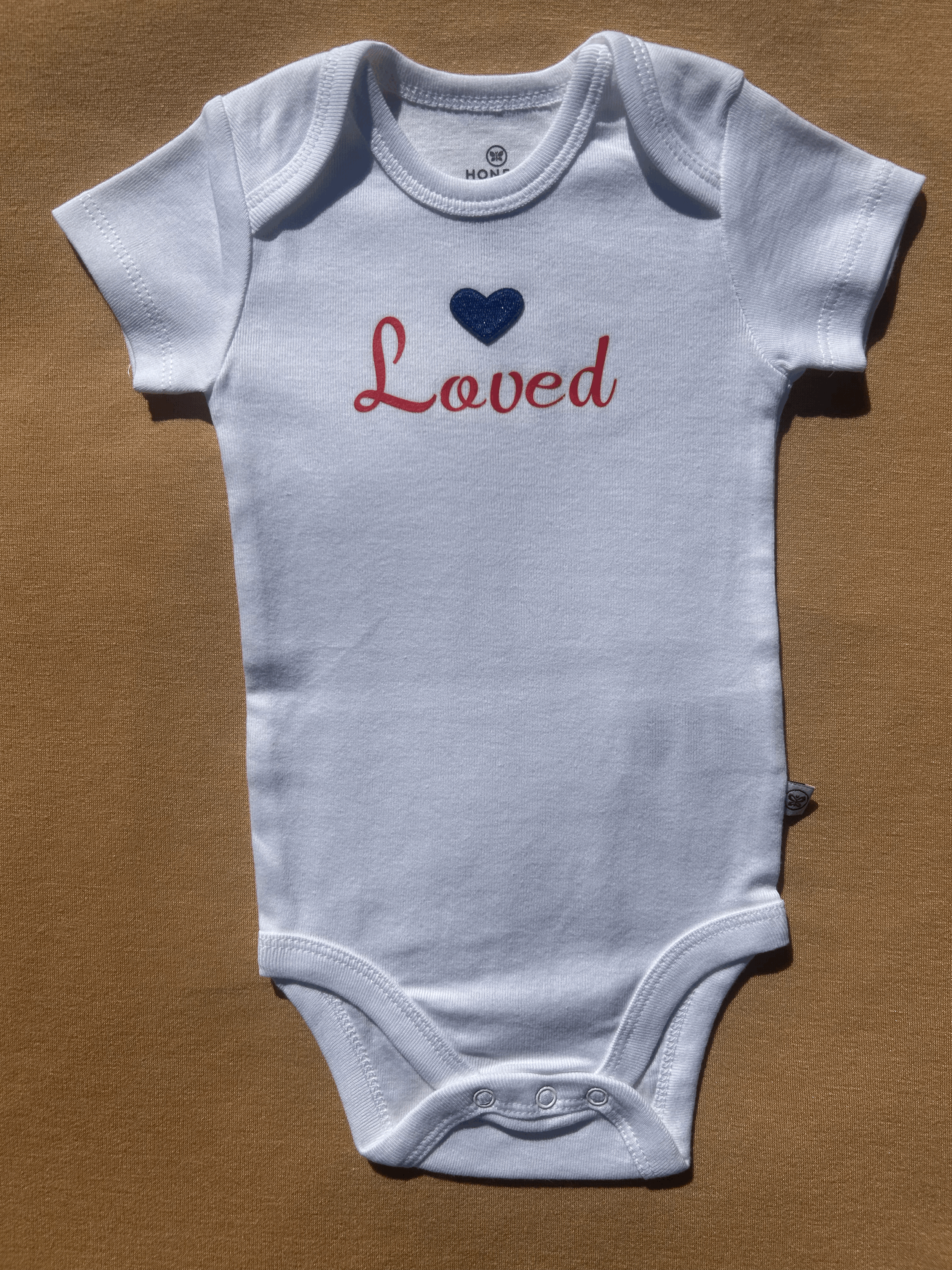 Organic Cotton 'Loved' Onesie with Heart Patch size 3 to 6 months