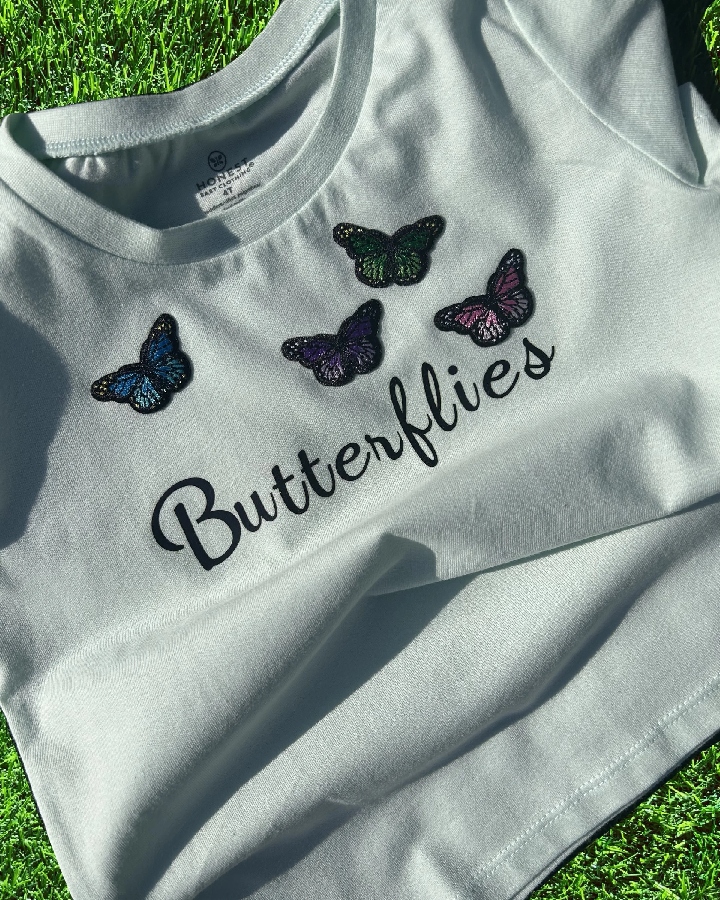 Four Butterflies on light sea green (4t)