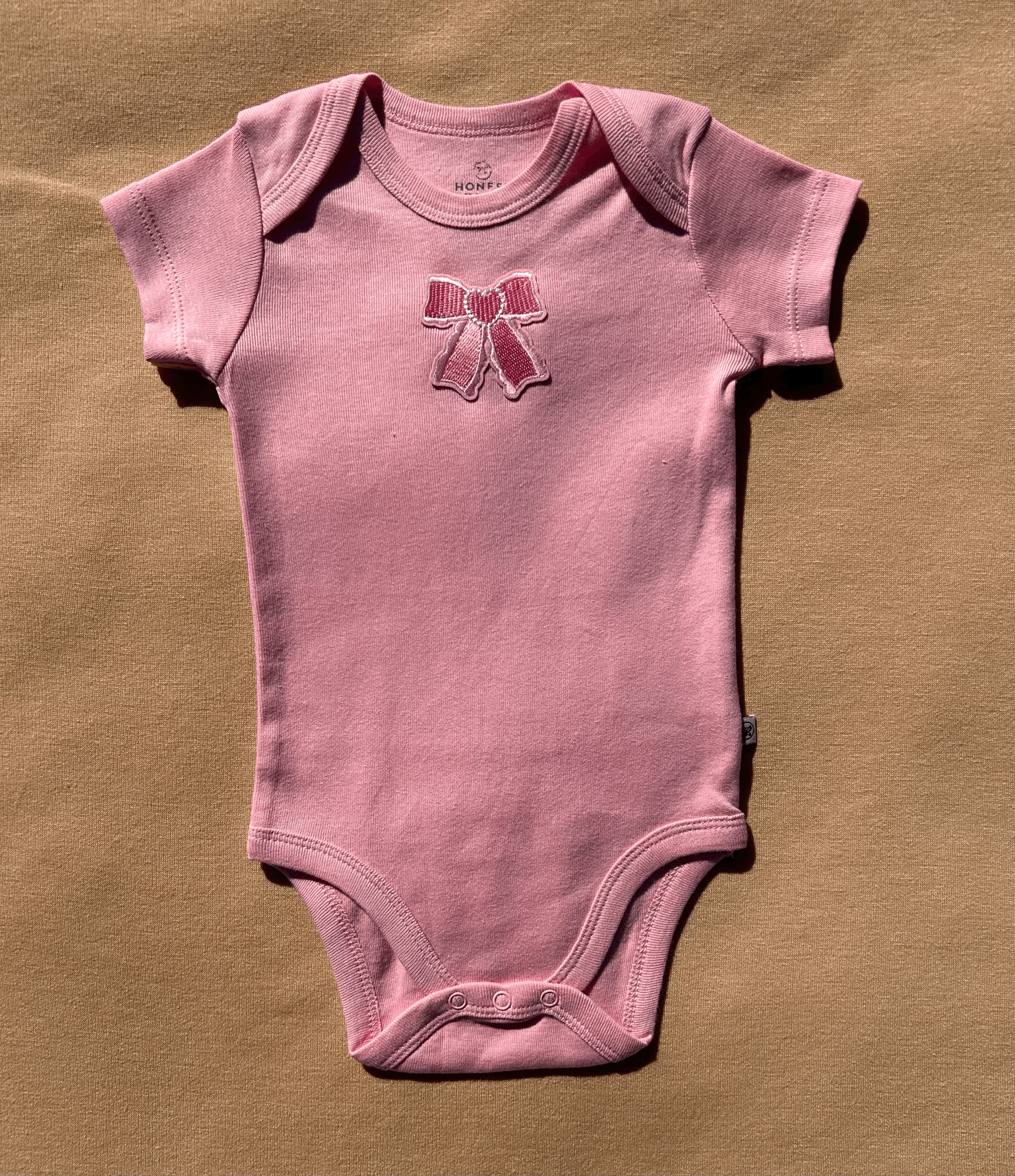 Charming Baby Pink Bow Onesie size 3 to 6 months