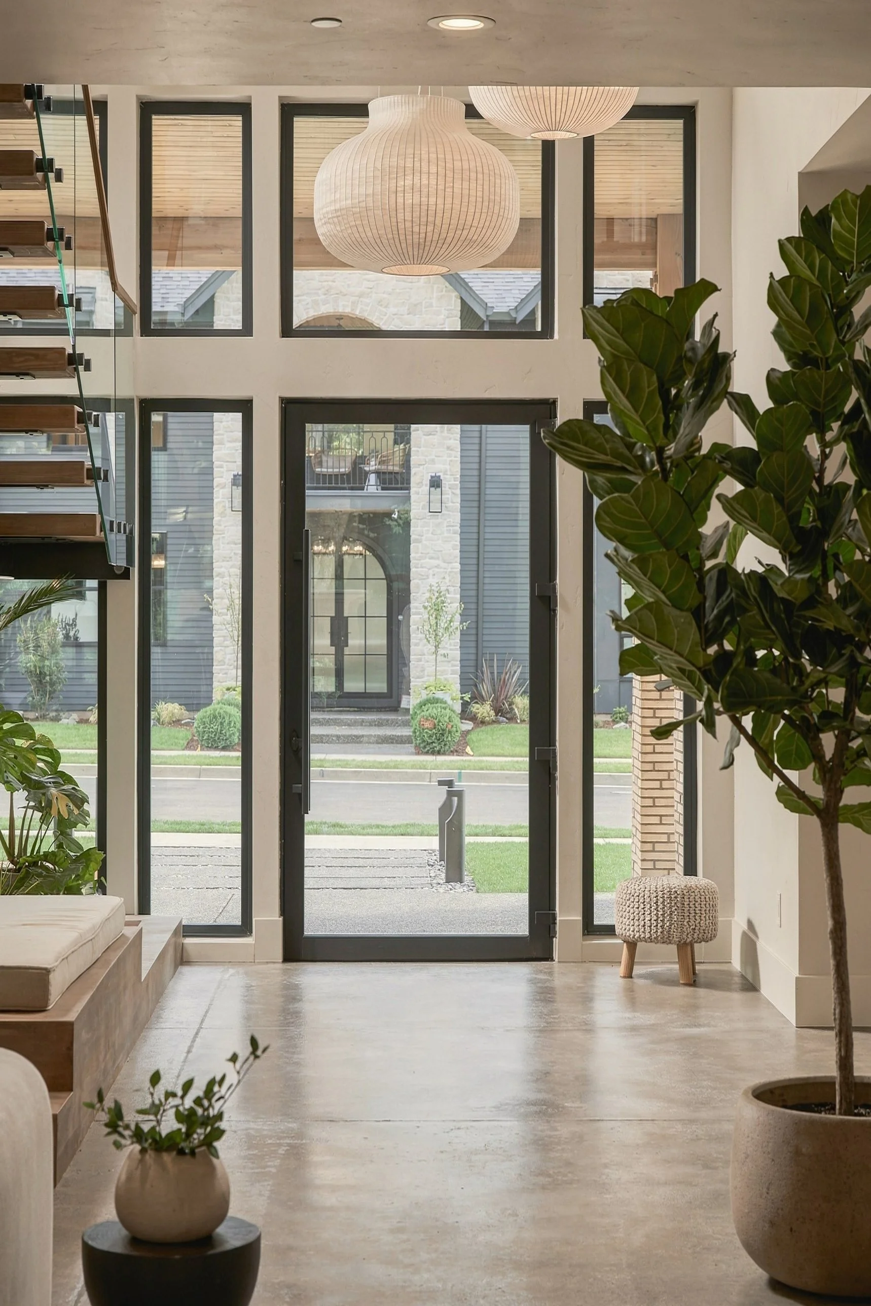 Glass front door and tall windows at the entry of The Sanctuary