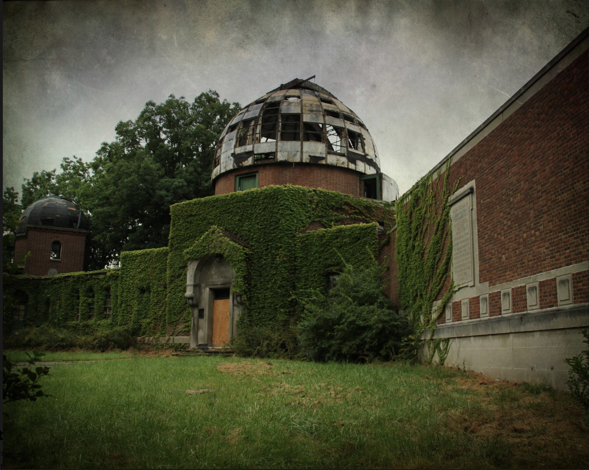 Vines and ivy growing over an abandoned observatory.