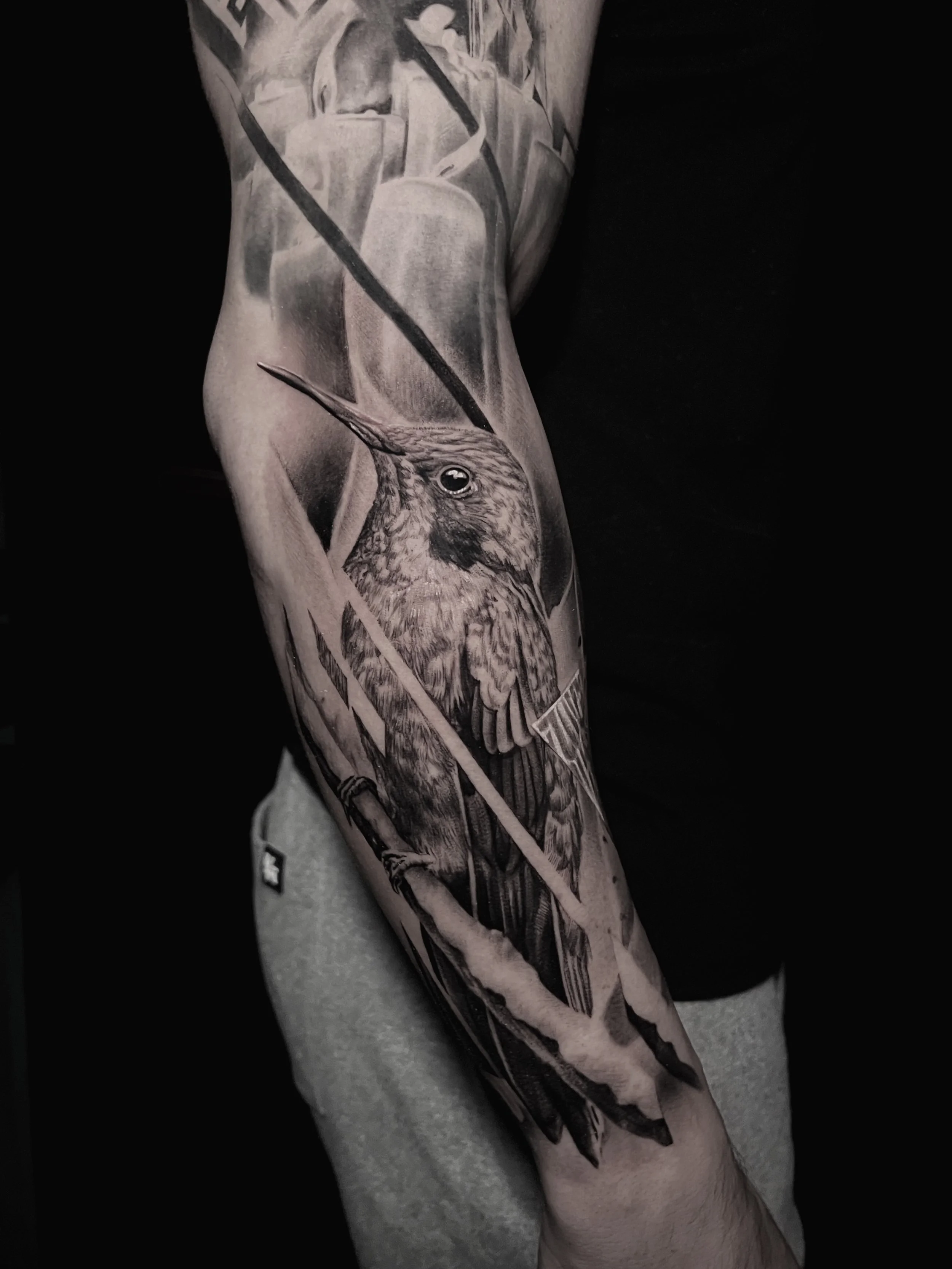 Innovative realistic black and grey tattoo hummingbird with graphic design integration In Los Angeles Area, at Outer Limits tattoo shop. by Jhon Gutti