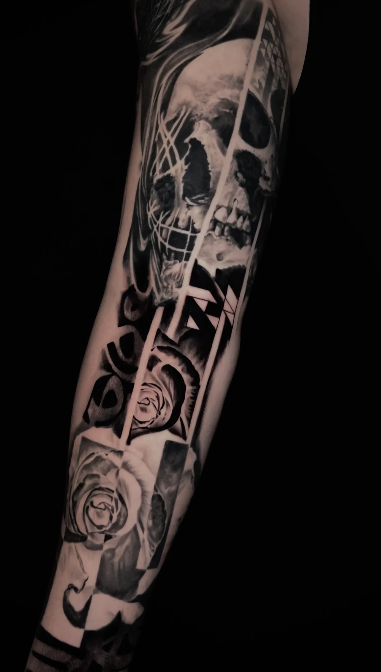 Innovative realistic black and grey tattoo Skull and roses with graphic design integration In Los Angeles Area, at Outer Limits tattoo shop. by Jhon Gutti