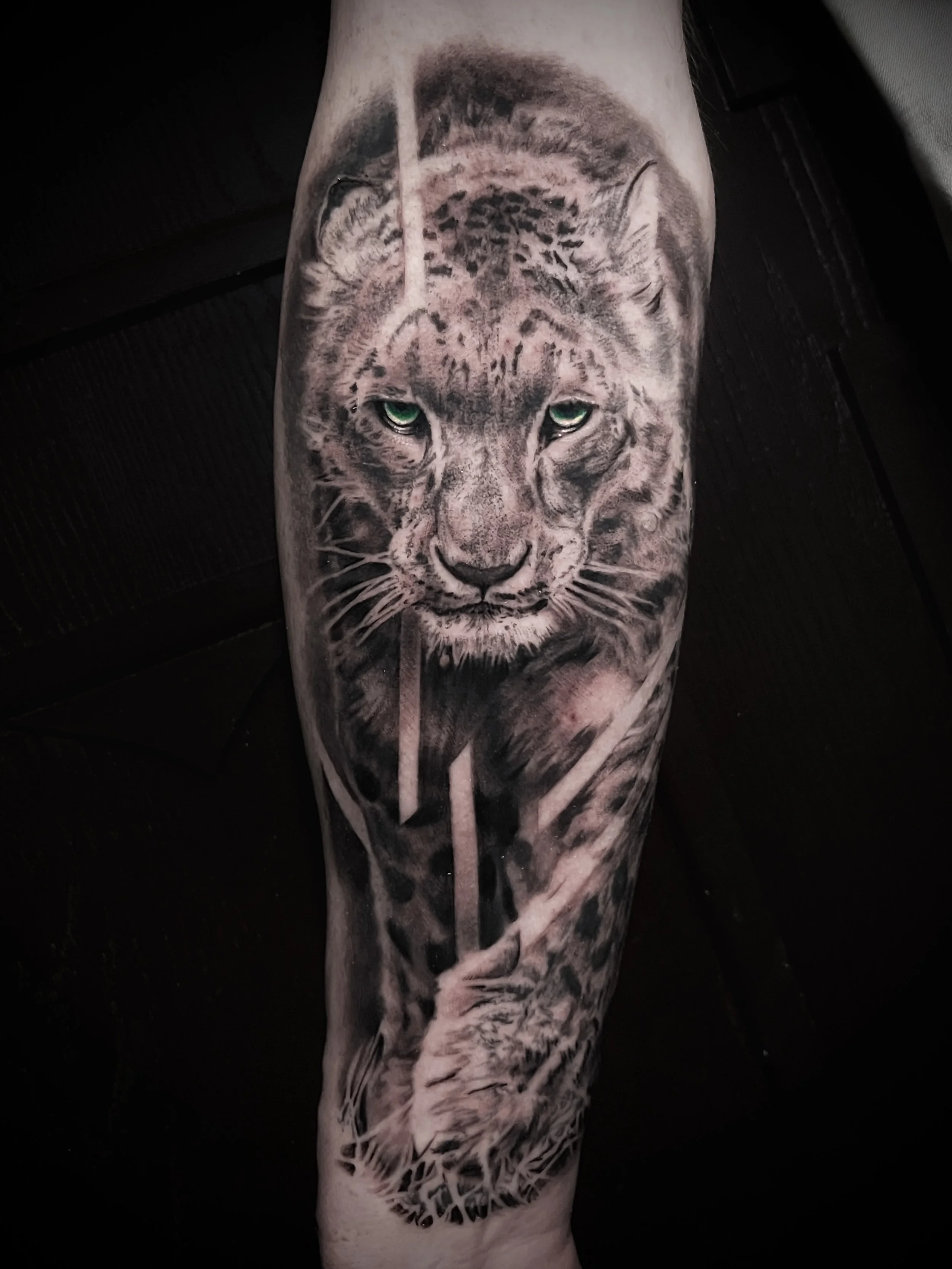 Innovative realistic black and grey tattoo snow Leopard with graphic design integration In Los Angeles Area, at Outer Limits tattoo shop. by Jhon Gutti