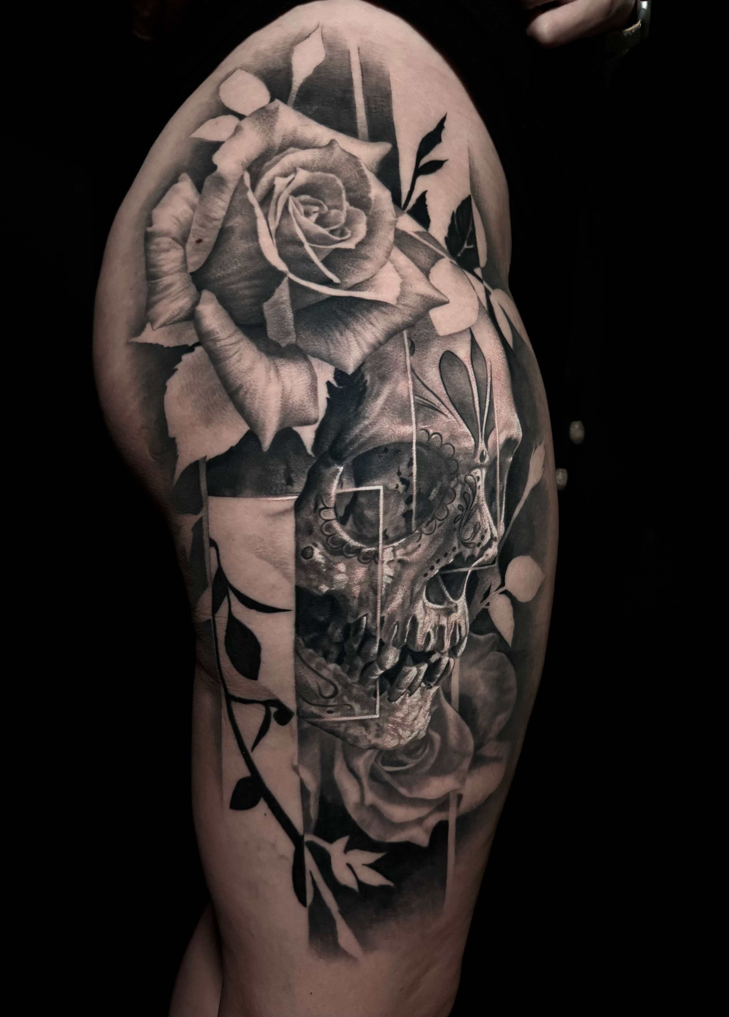 Innovative realistic black and grey tattoo day of the dead skull and roses with graphic design integration In Los Angeles Area, at Outer Limits tattoo shop. by Jhon Gutti