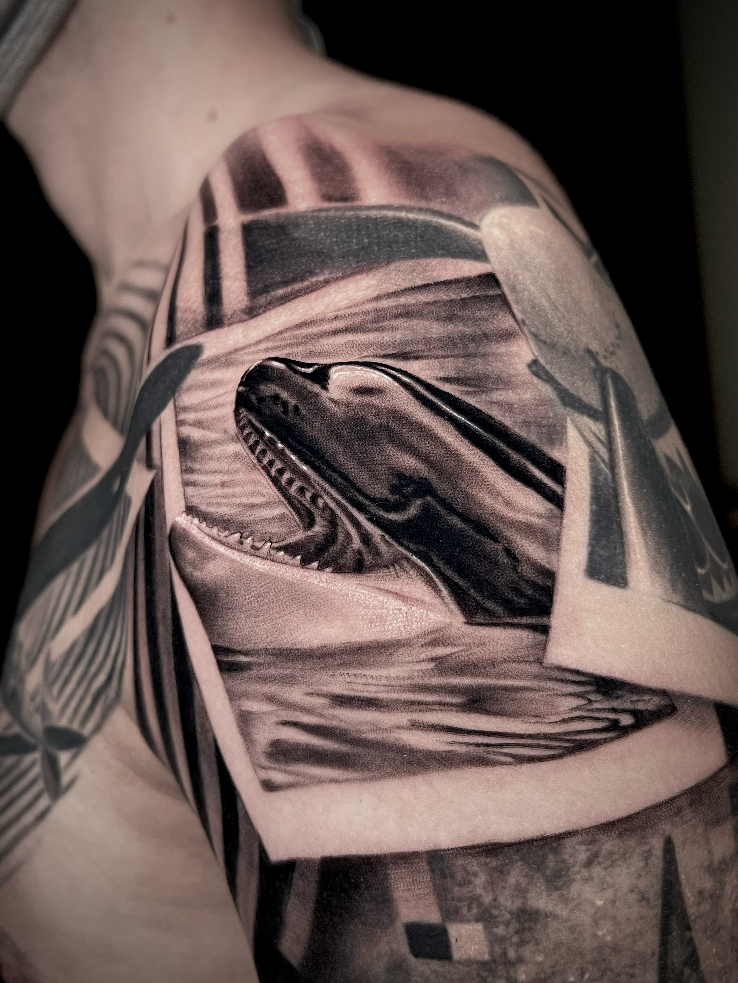 realistic black and grey tattoo Orca Whale with graphic design integration In Los Angeles Area, at Outer Limits tattoo shop. by Jhon Gutti