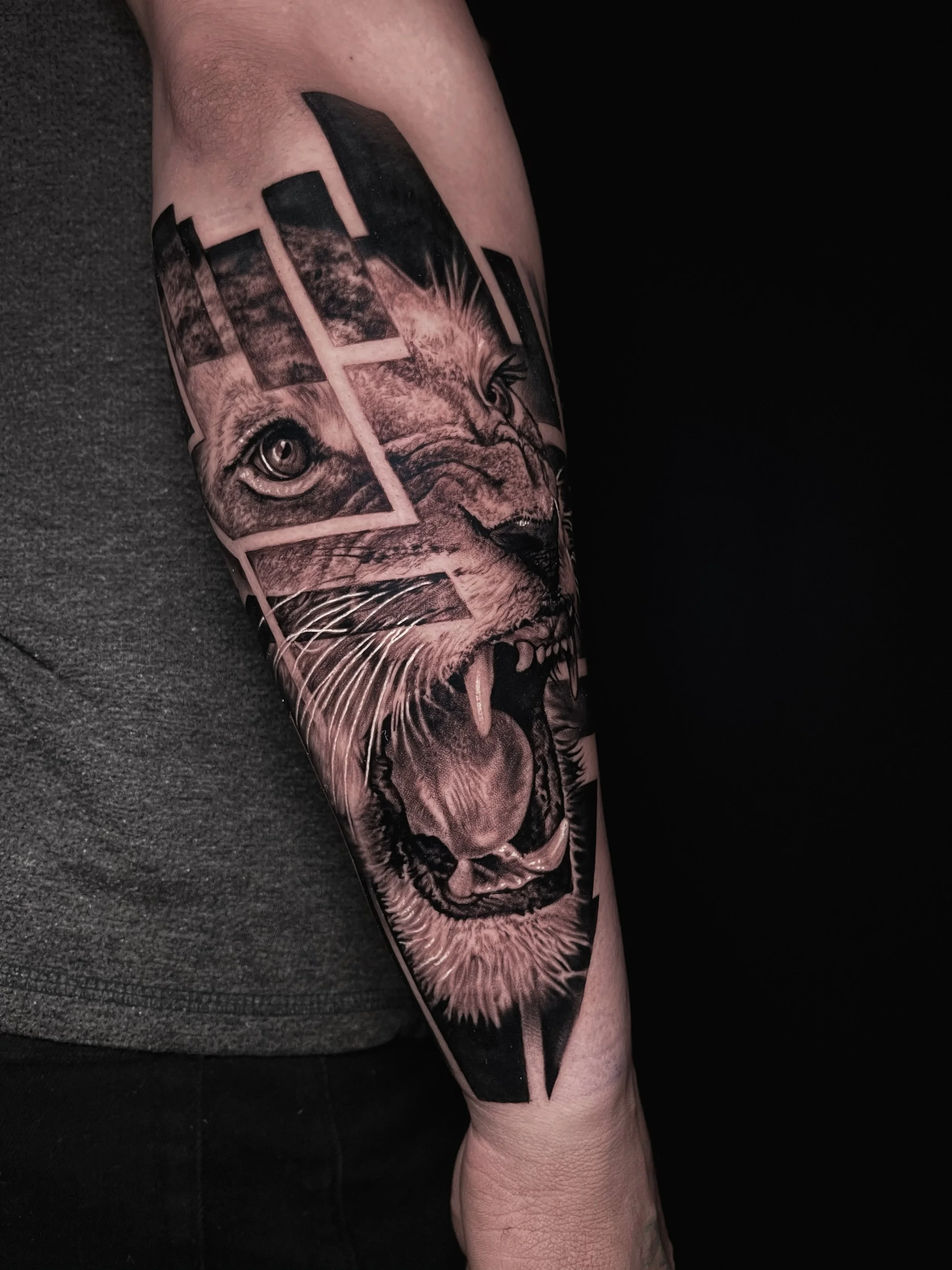 Innovative realistic black and grey tattoo Lioness with graphic design integration In Los Angeles Area, at Outer Limits tattoo shop. by Jhon Gutti