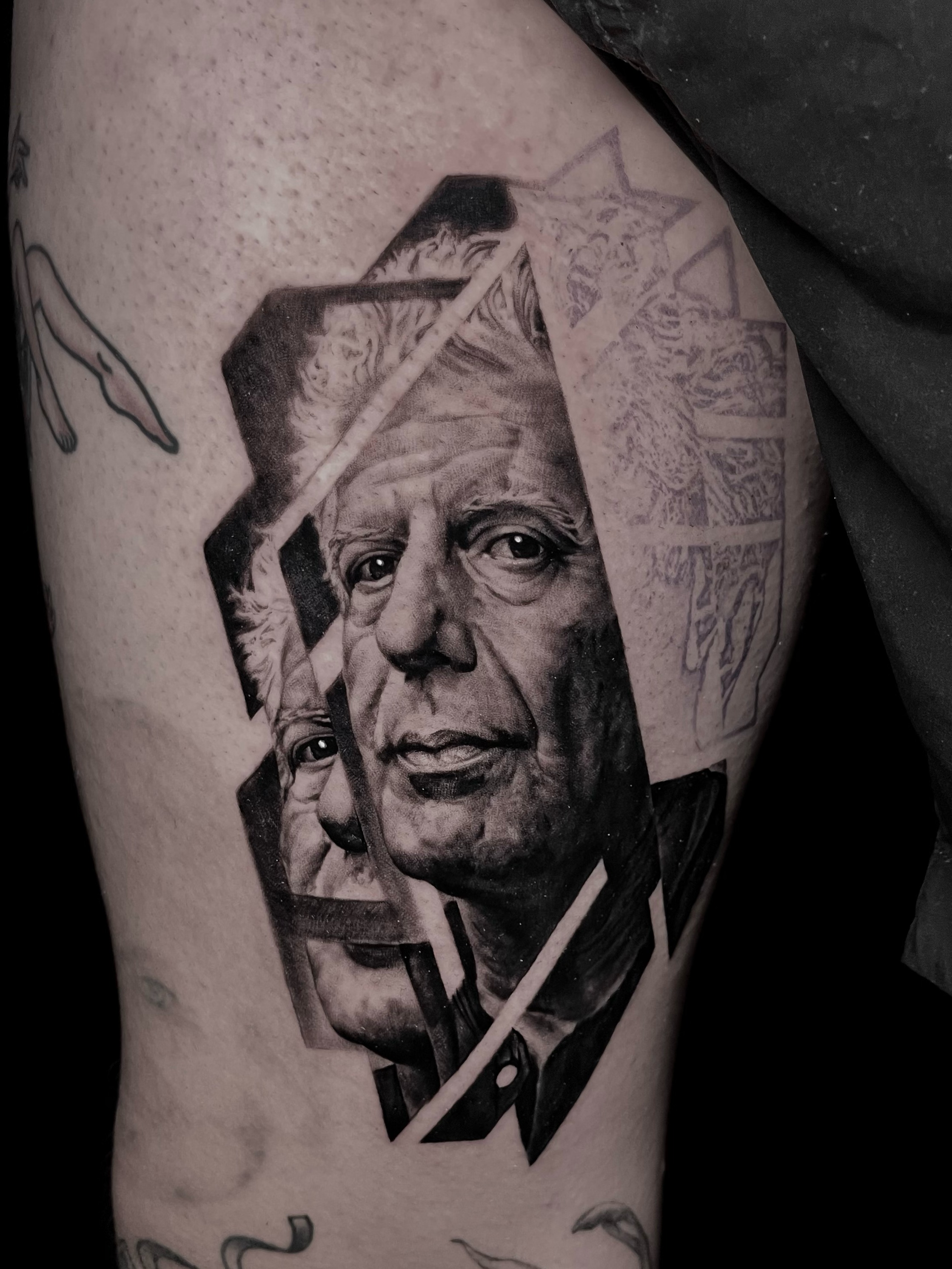 Innovative realistic black and grey tattoo portrait of Anthony Bourdain Clouded Leopard with graphic design integration In Los Angeles Area, at Outer Limits tattoo shop. by Jhon Gutti