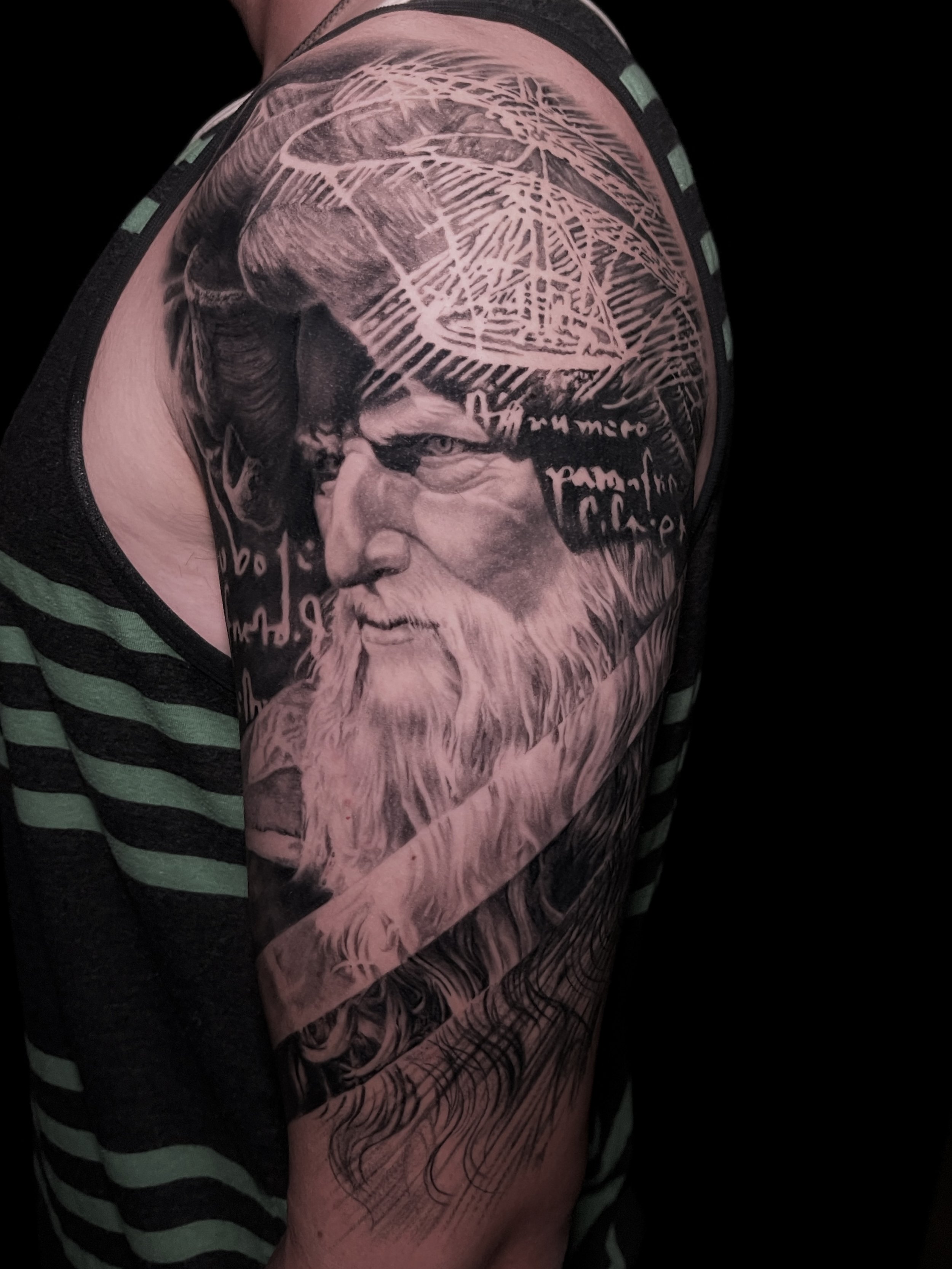 Innovative realistic black and grey tattoo Portrait of Leonardo da Vinci with graphic design integration In Los Angeles Area, at Outer Limits tattoo shop. by Jhon Gutti