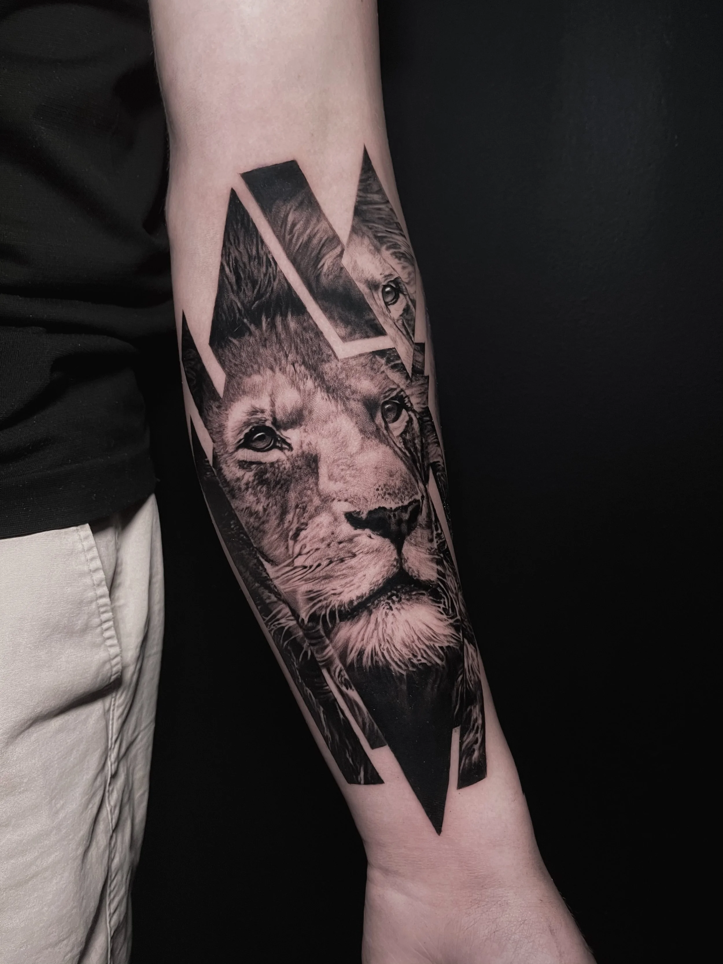 Innovative realistic black and grey tattoo 
Lion with graphic design integration In Los Angeles Area, at Outer Limits tattoo shop. by Jhon Gutti