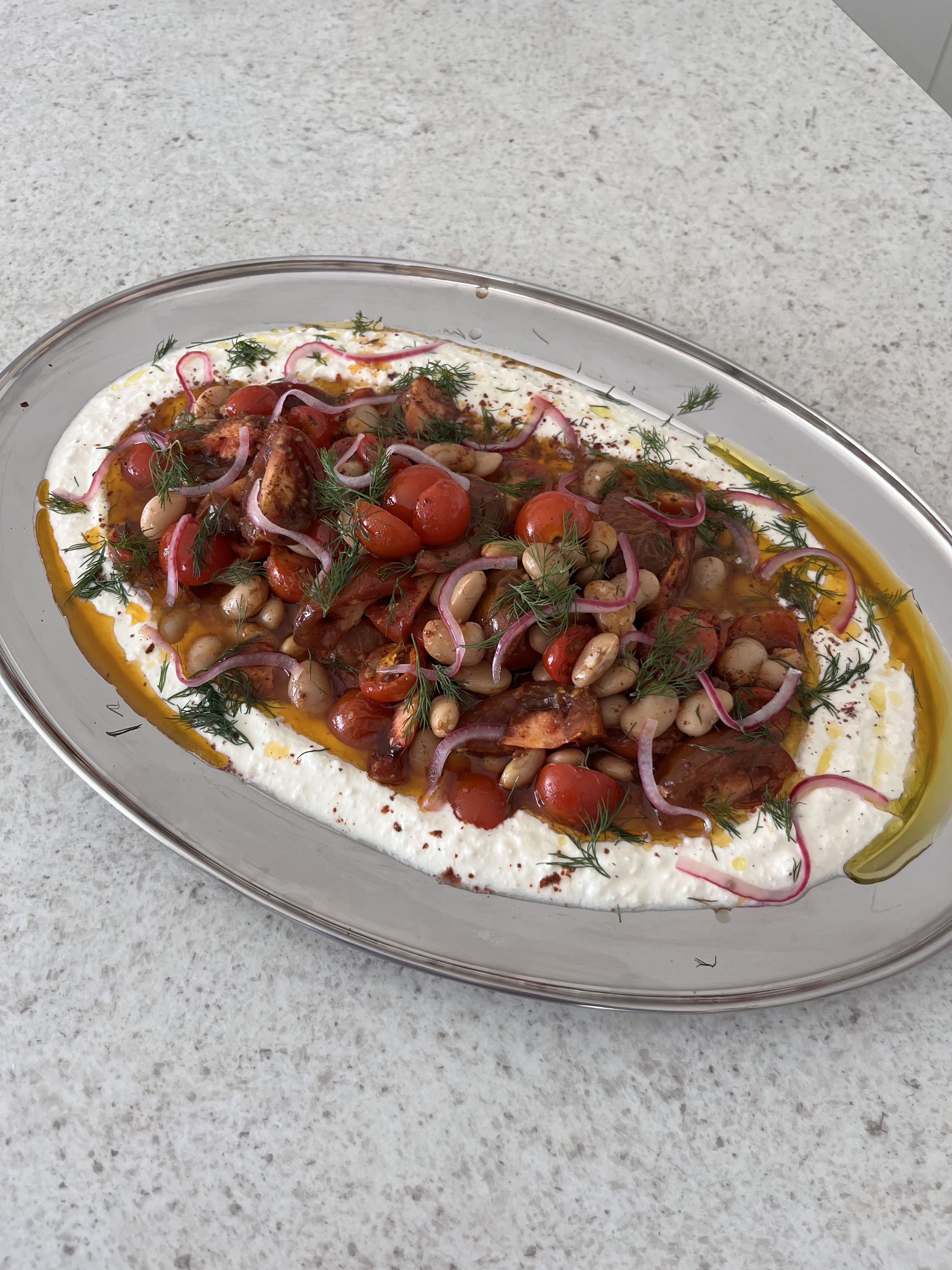 spiced roast tomatoes and butter beans with yoghurt and pickled red onion