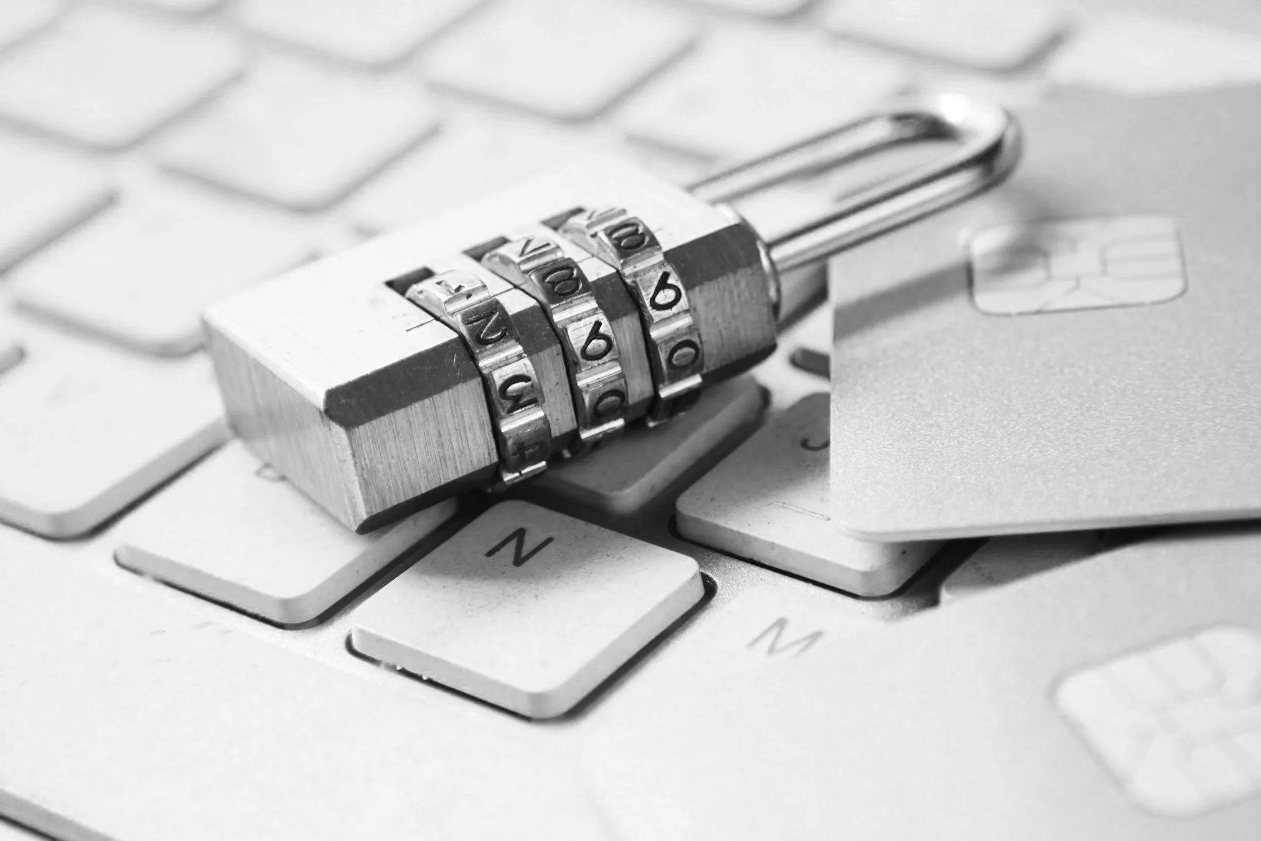 City skyline with modern skyscrapers in London, including The Gherkin and The Shard, under a cloudy sky.
