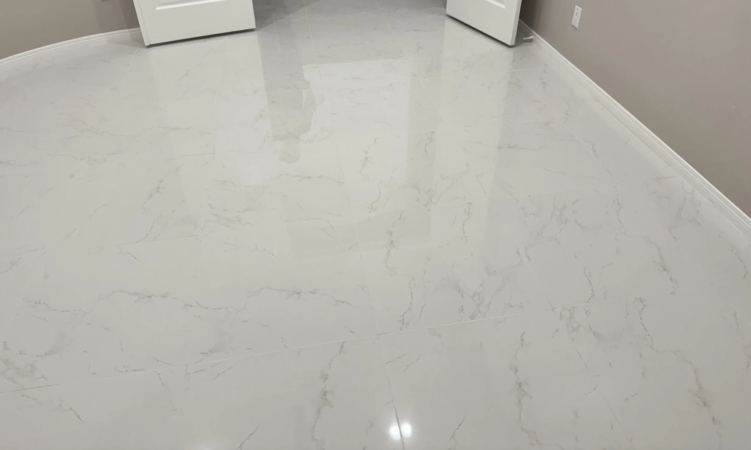 Large format tile flooring installation.