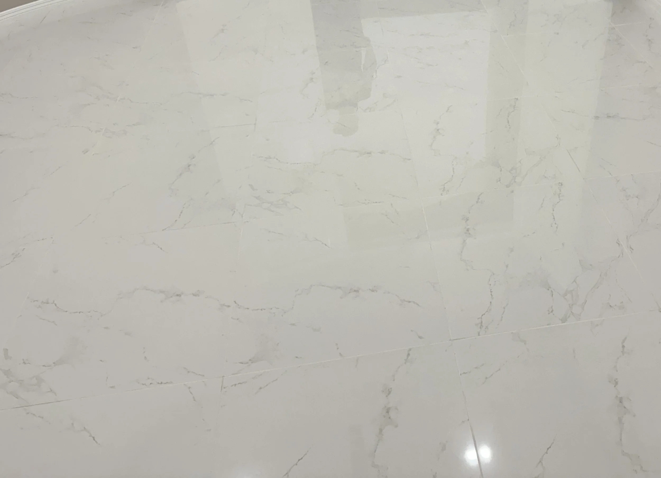 Large format tile flooring installation.