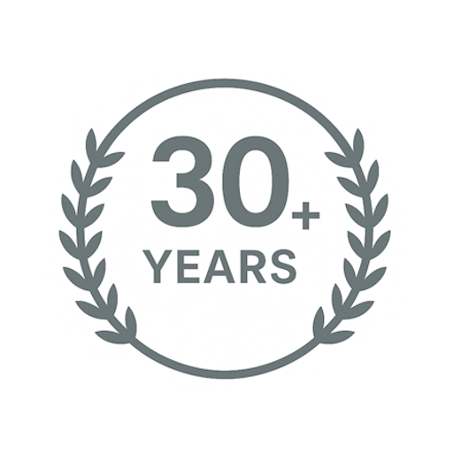 A logo with a circular laurel wreath surrounding the text "30+ Years" in gray, on a black and white background.