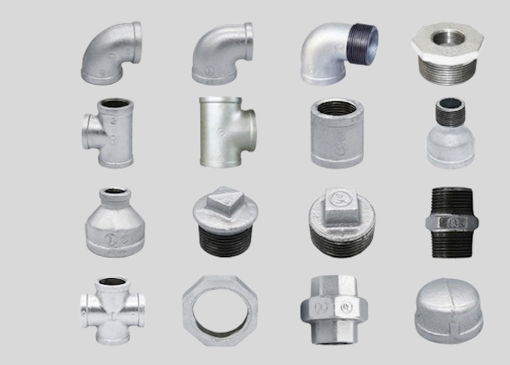 A collection of metal plumbing (galvanised iron, ie. gi) components including elbows, couplings, fittings, and caps displayed on a light gray background.