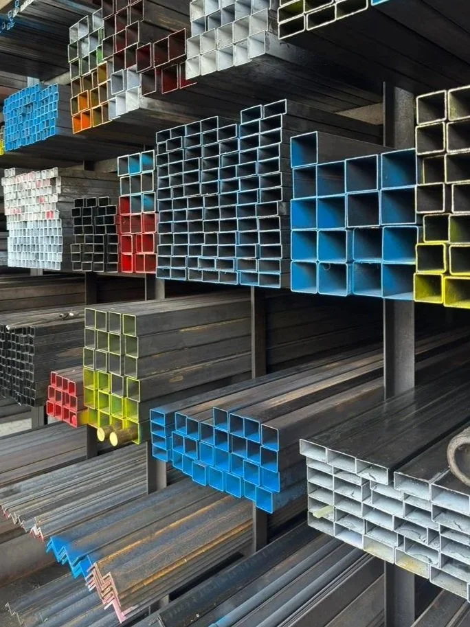 Steel pipes and metal rods stored in a hardware store or warehouse, hollow section.